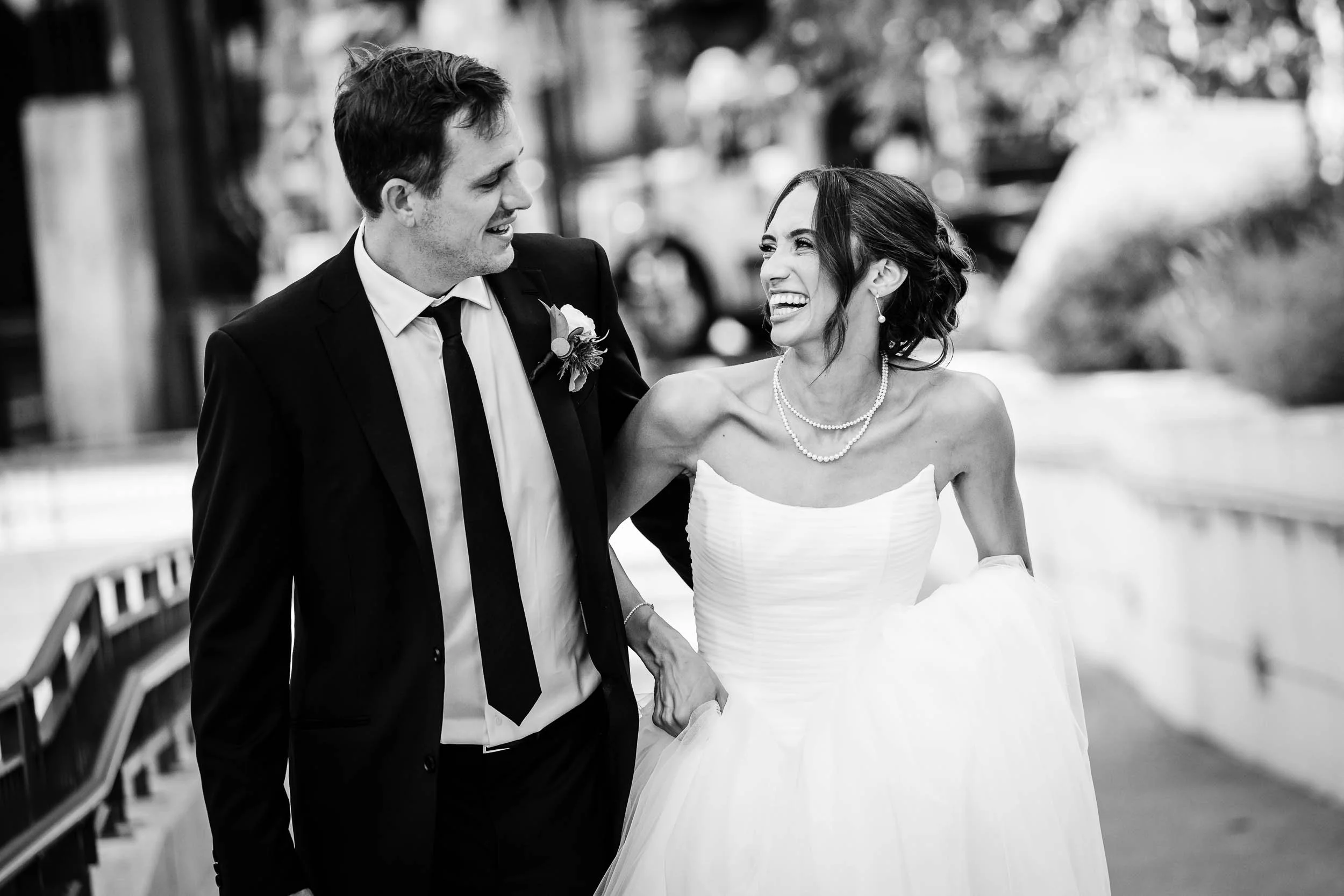 Mae District | Bride and groom walk along Riverpoint Park | Chicago IL