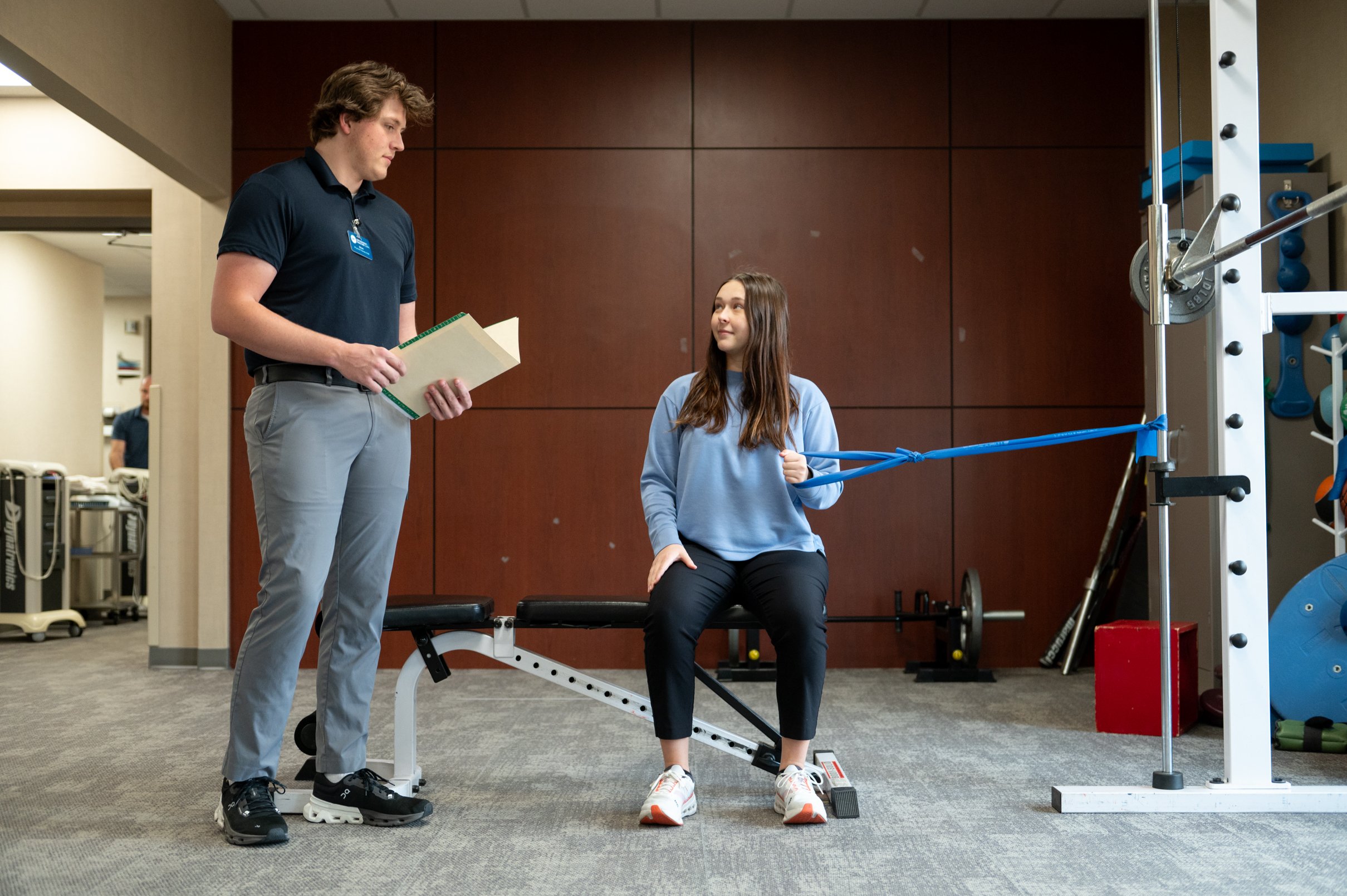 patient working with physical therapist on shoulder excercises