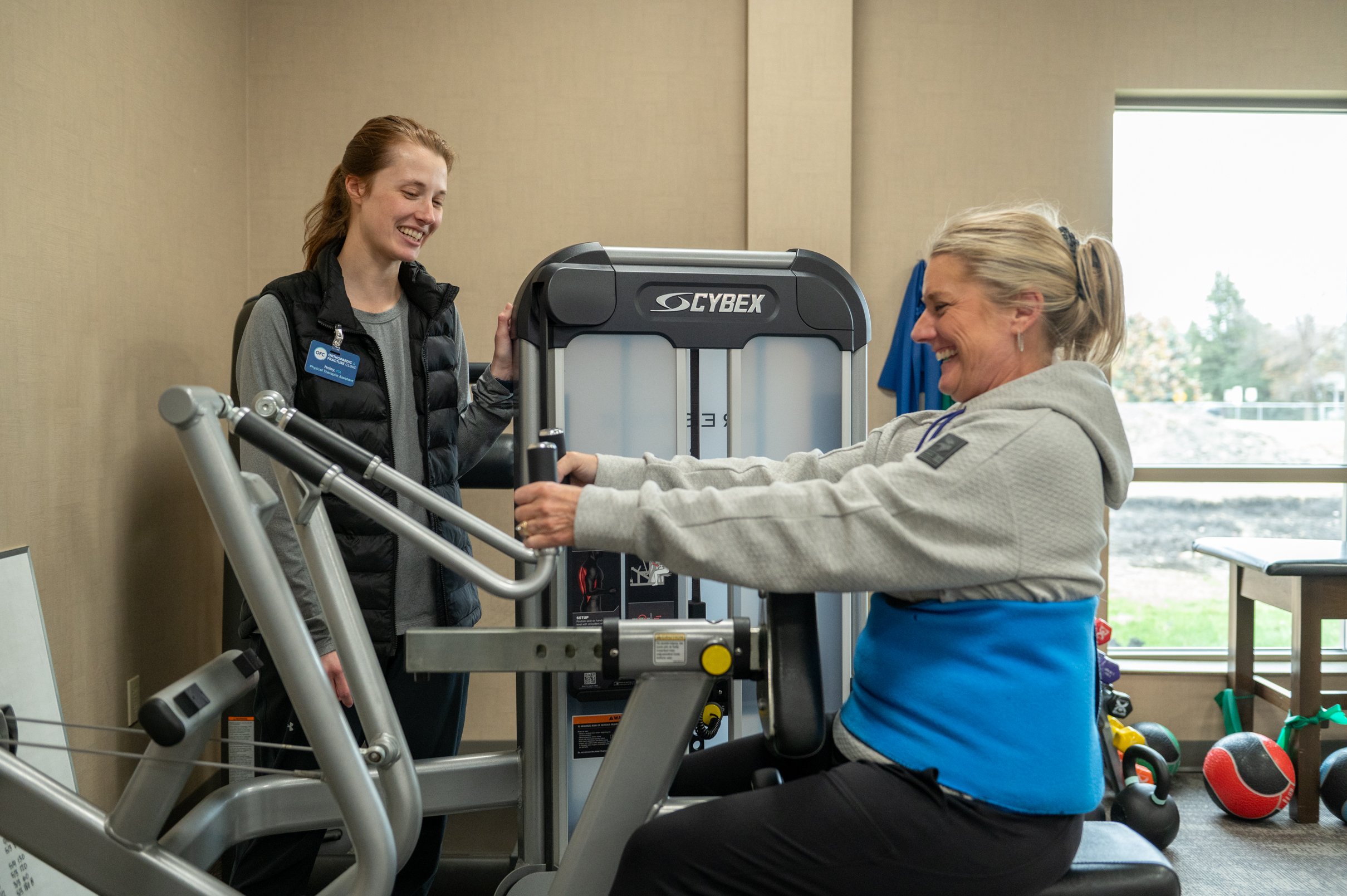 physical trainer working with patient