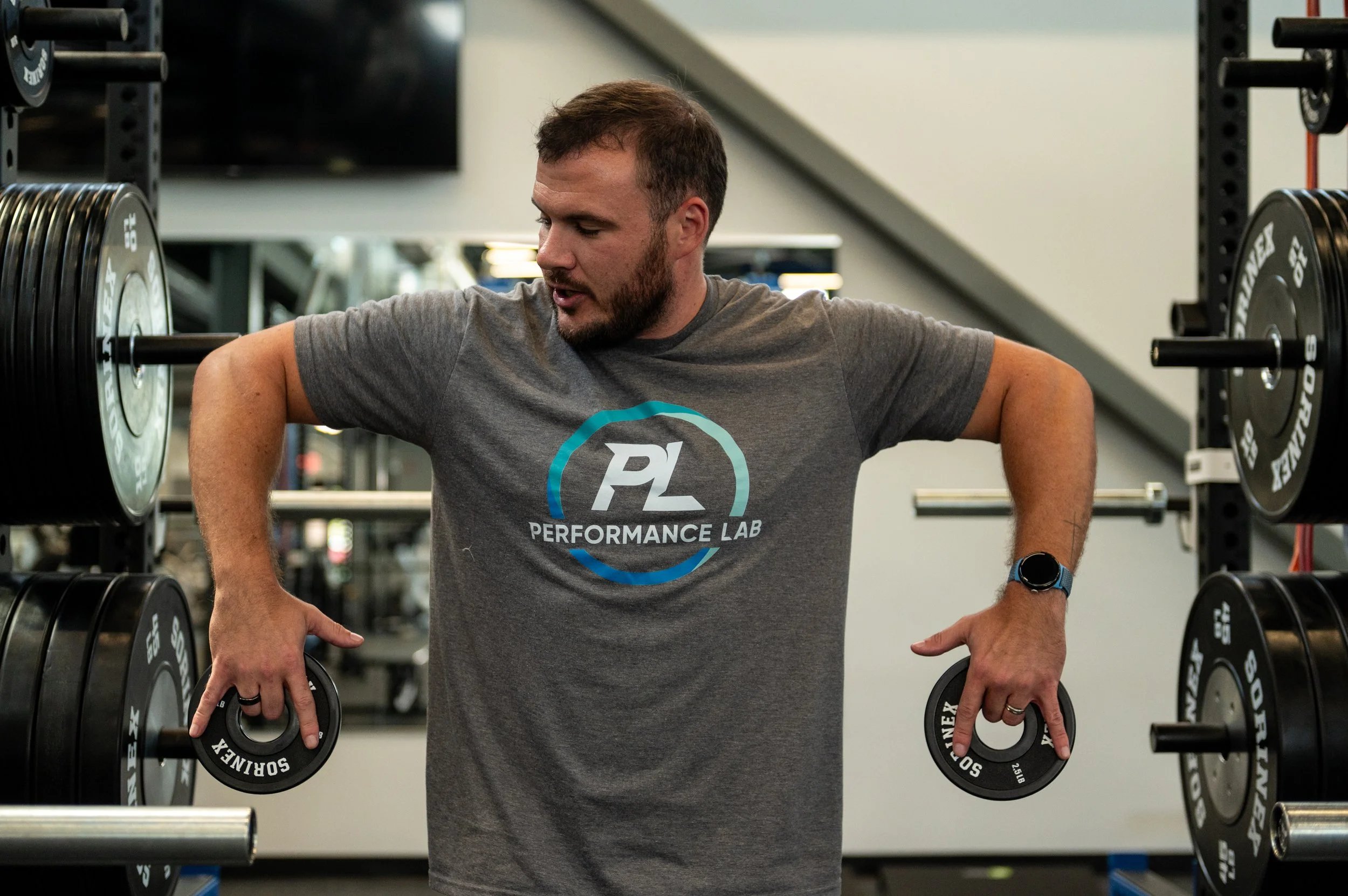 landon working with weights training his arms