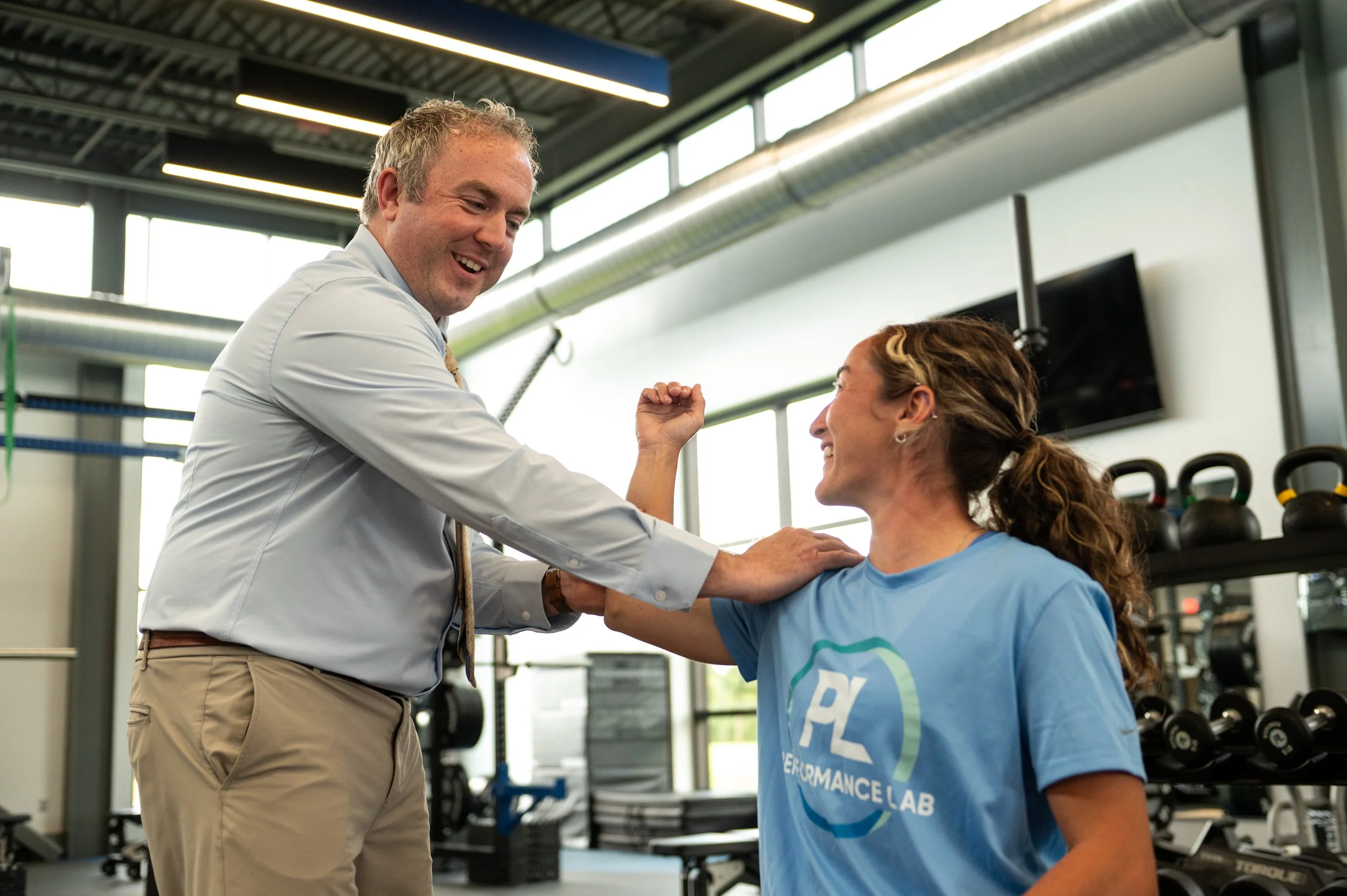 dr. mcnamara working with patient on elbow