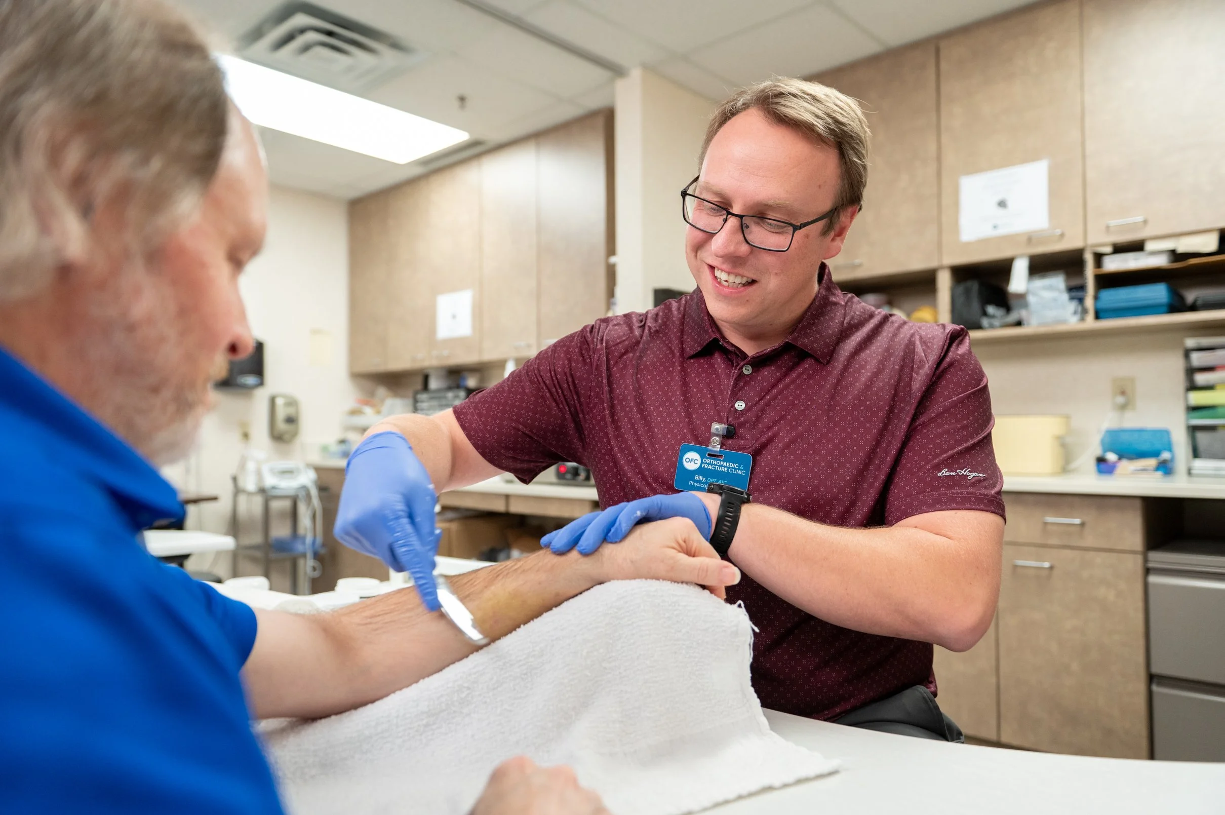 Doctor working on patients arm