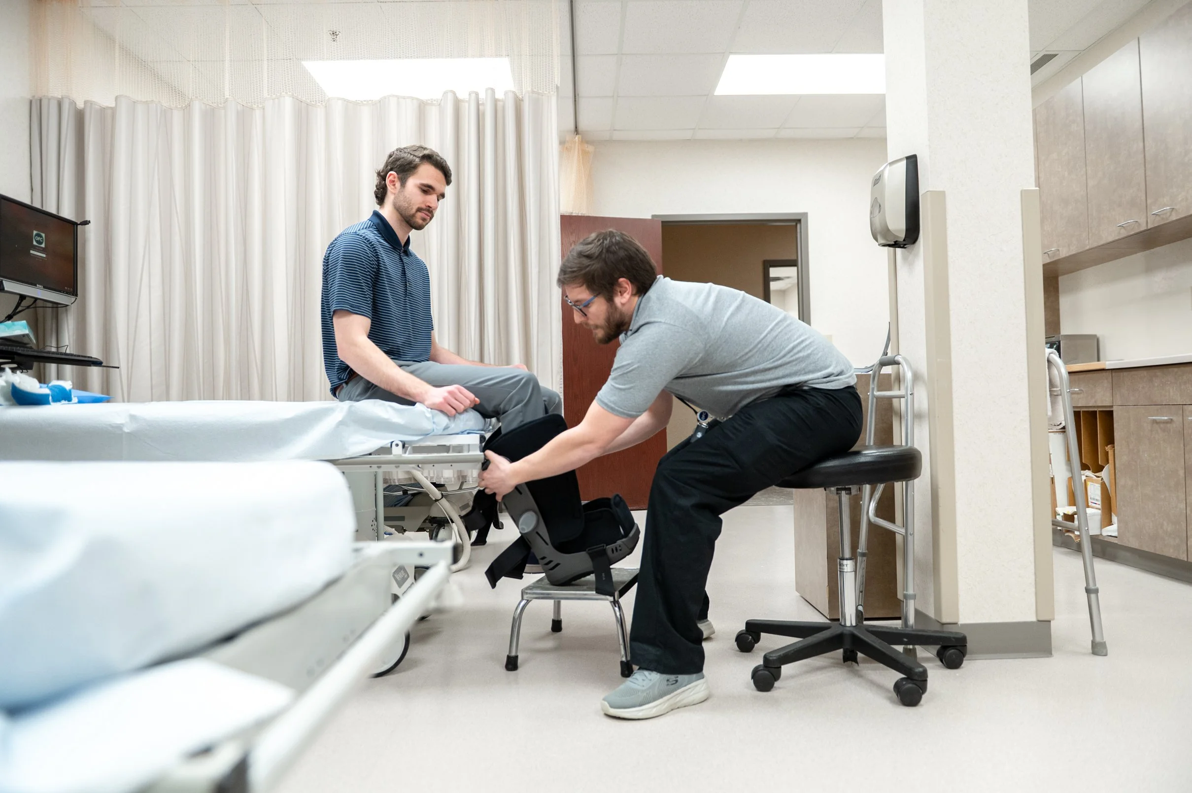 working with a patient on their foot