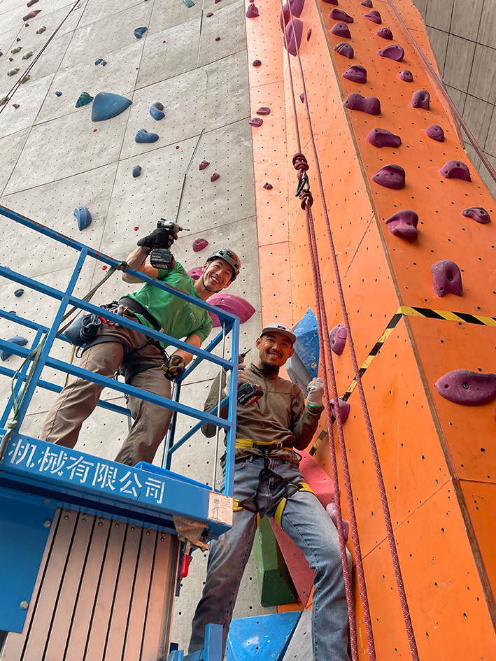 Chaozai and I setting up some crack routes at a climbing wall in Chengdu during the winter of 2023.