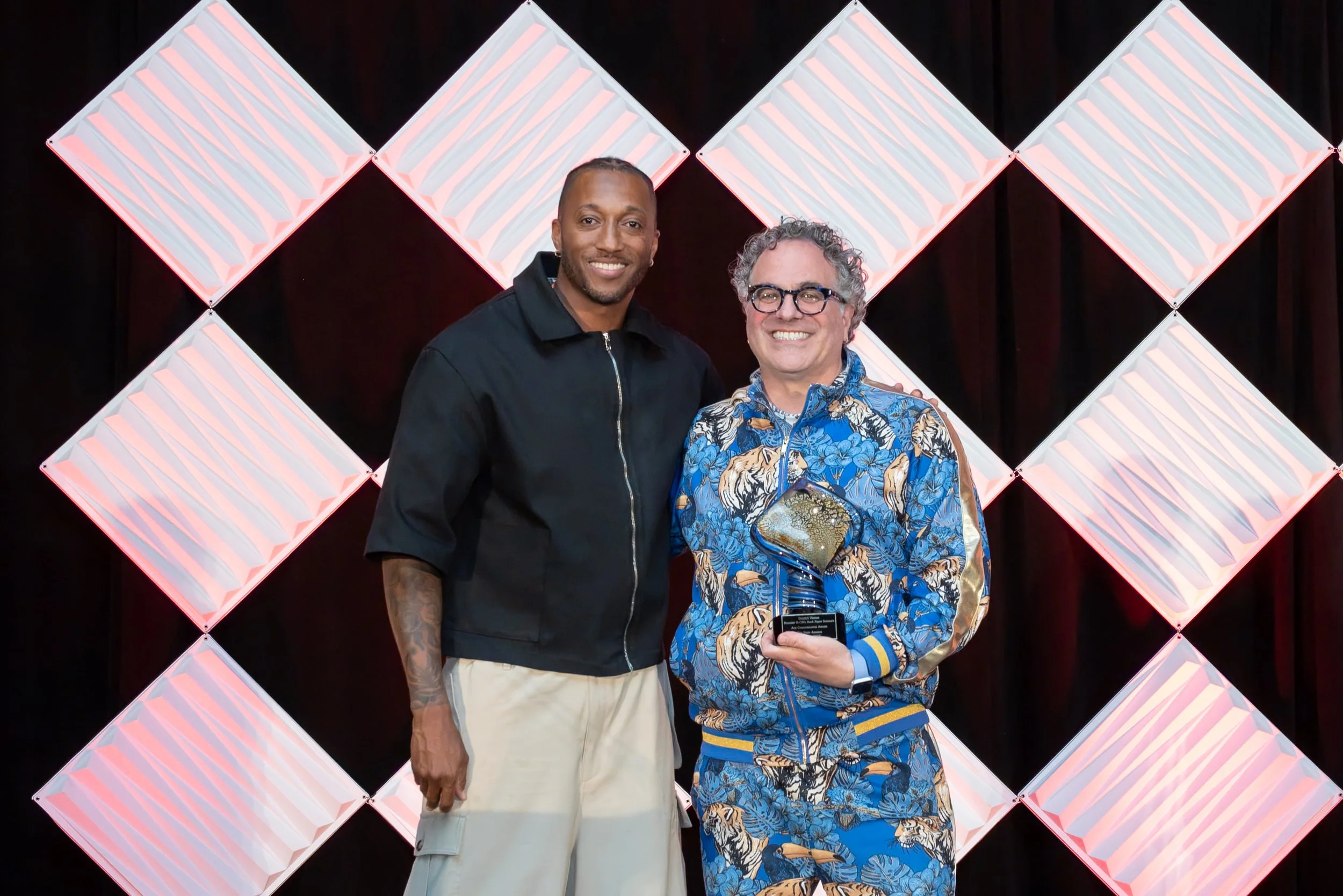Dmitri Vietze winning the Ace Communicator Award at Music Biz 2026, with host Lecrae. Photo credit: Picture This! Photography