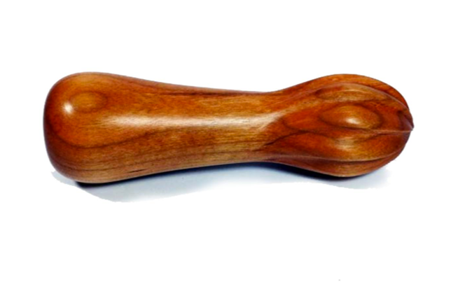 A wooden massage hammer with a rounded handle and a slightly bulbous head.