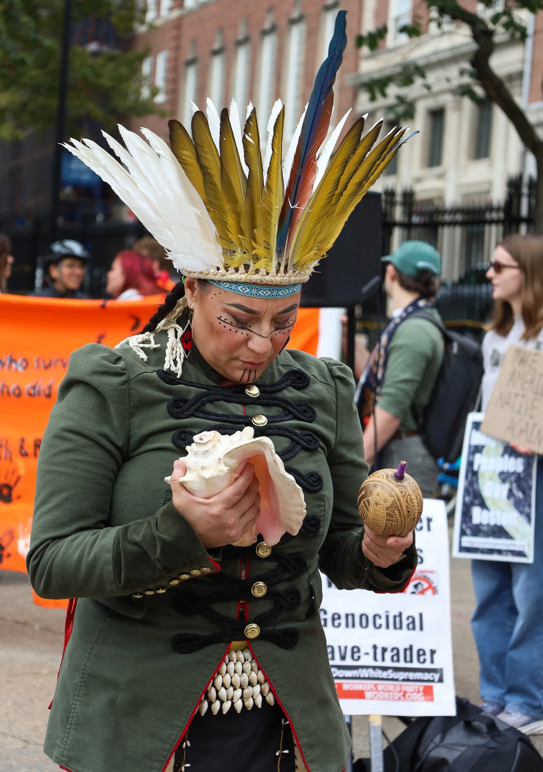 BOSTON, MA--10.11.25--Chali'naru Dones takes part in a ceremony commemorating the Indigenous land at the Boston Common. The ceremony came prior to the Indigenous Peoples' Day March down Tremont Street with Indigenous communities and allies. 