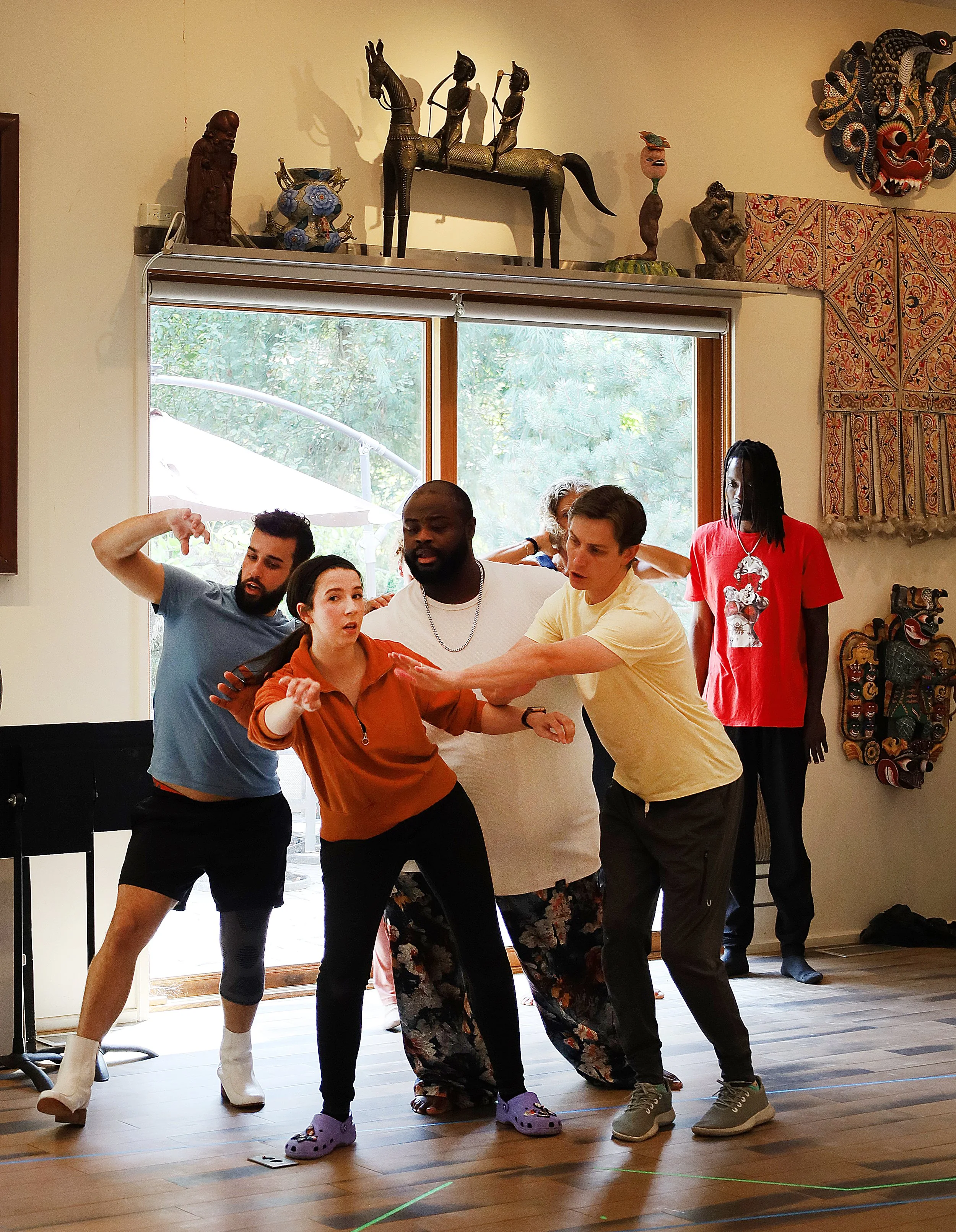 BROOKLINE, MA—9.14.25--Performers rehearse for White Snake Projects’ “White Raven Black Dove,” at the Strand Theatre. (From left to right) Lucas Ludwig Coura, A.J. Ramsey, Daon Drisdom, and Scott Ballantine dance in an ensemble at rehearsal. 