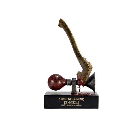 An award trophy with a hammer and axe mounted on a black base that reads 'Kings of Horror, Genre Killers, MVP: Spencer Charles.'