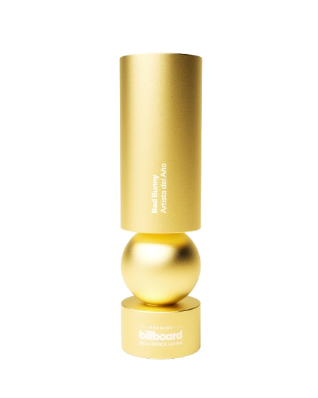 Golden trophy with a cylindrical top and spherical middle, engraved with the words 'Bad Bunny Artist of the Year' and a base with a Billboard logo.