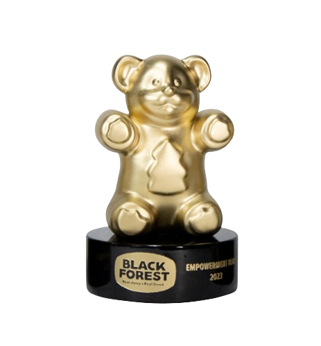 Golden teddy bear award on black base with Black Forest logo and 'Empowerment Award 2023' engraved.