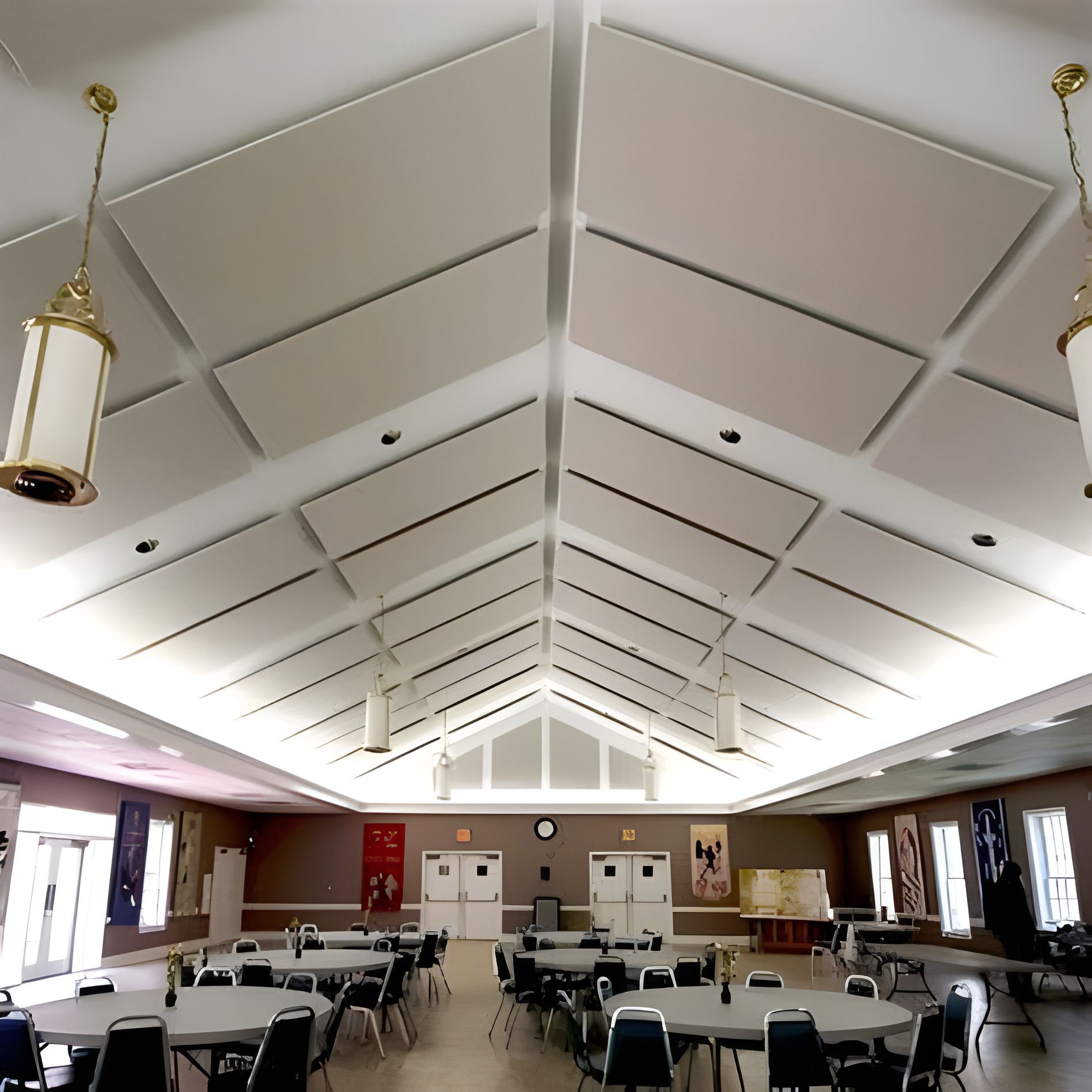 Large banquet hall with acoustic ceiling panels. fabric wrapped acoustic panels. fabric acoustic panels. fabric panels. soundproofing a gymnasium. soundproofing acoustic panels. soundproofing fabric acoustic panels