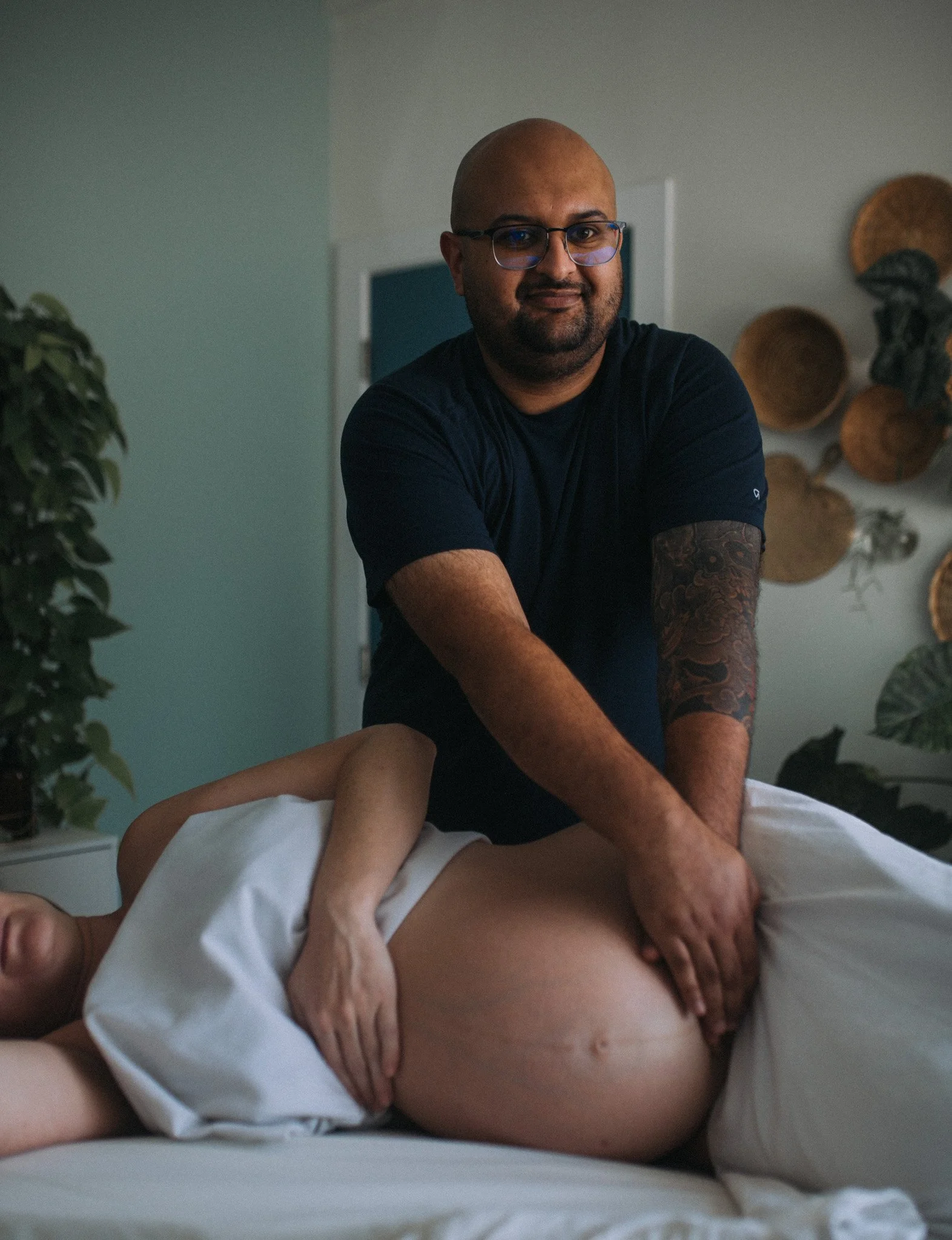 male massage therapist doing prenatal massage in victoria bc