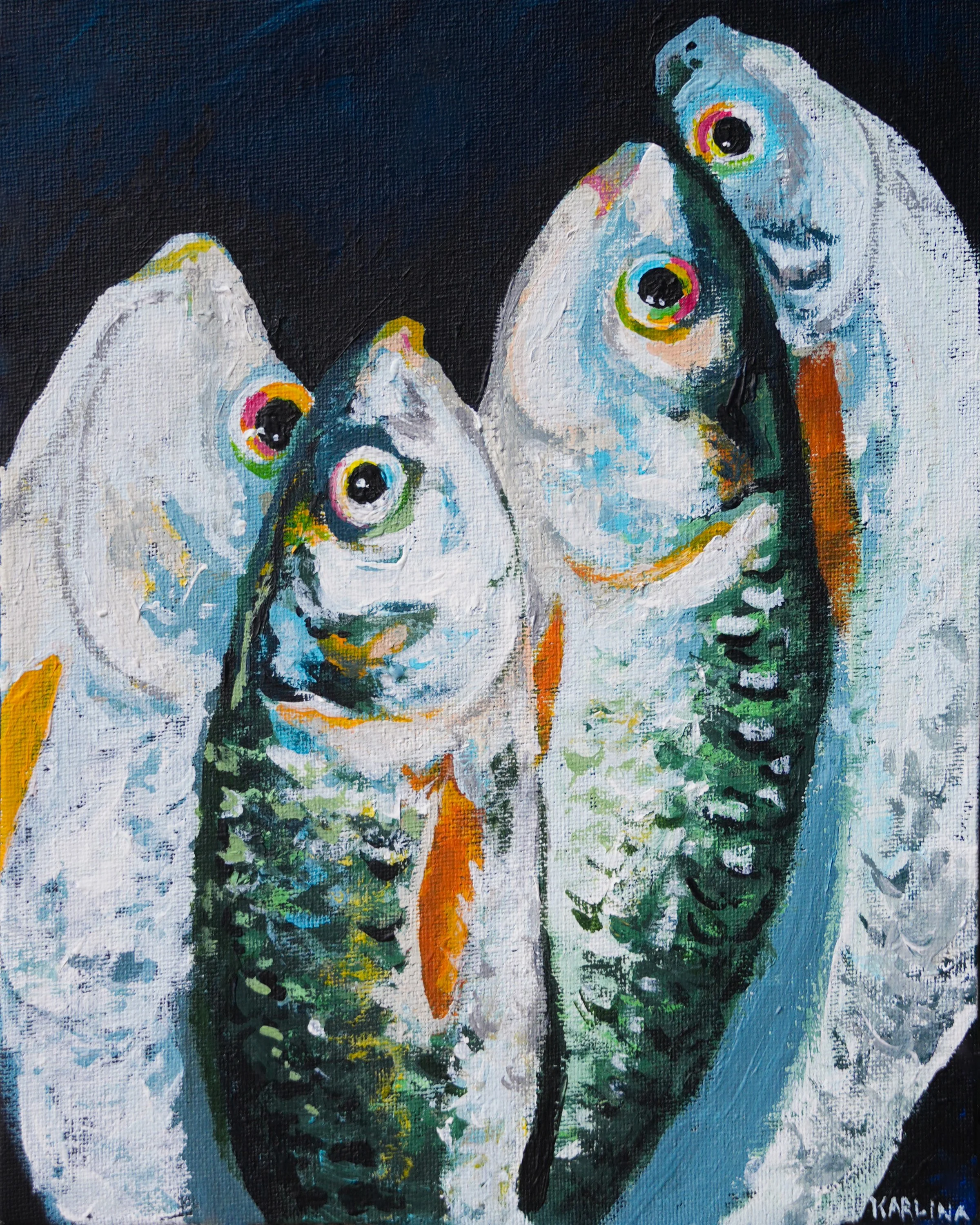 Abstract painting of three white fish with colorful eyes, orange fins, and black tails against a dark background with splashes of green, blue, yellow, and other colors.