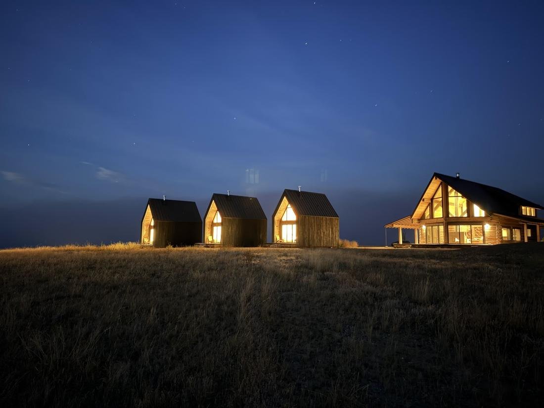 dark	Reed Retreat compound after dark under a night sky