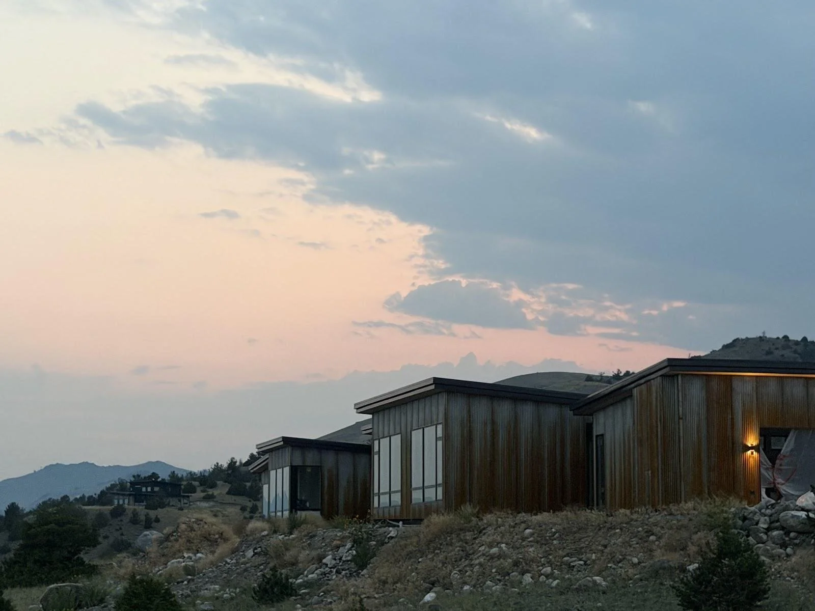 Paradise View custom home at dusk, Emigrant, Montana