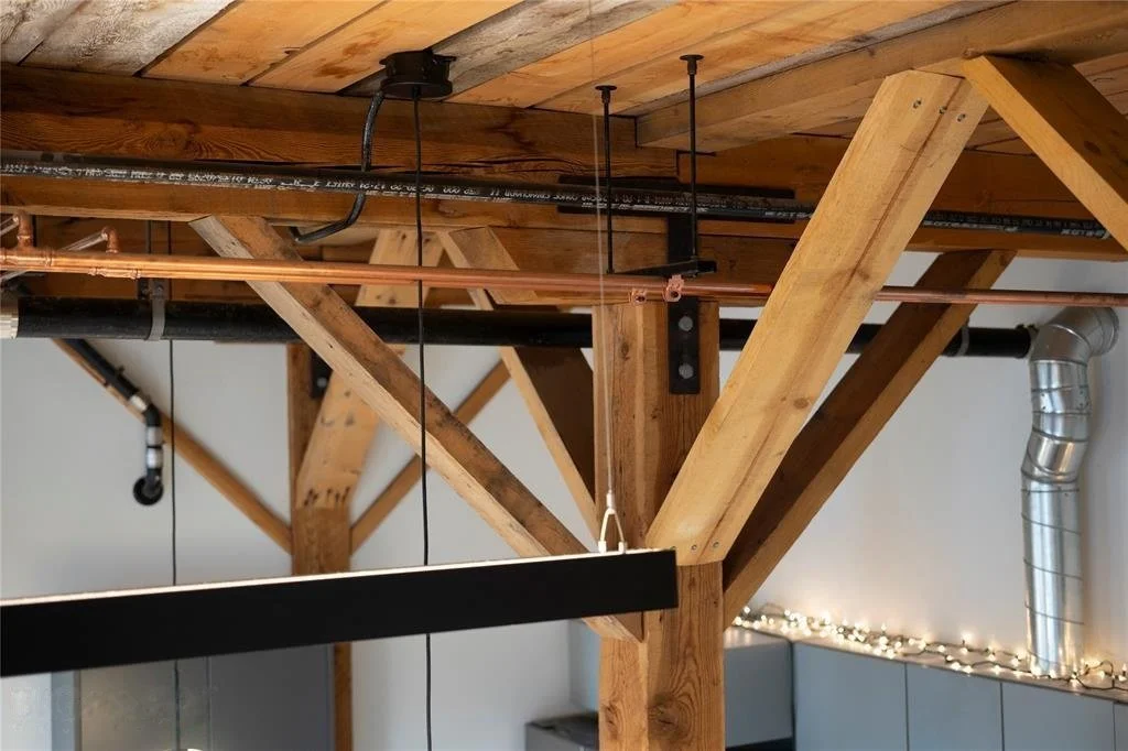 Exposed original timber structure inside The Granary