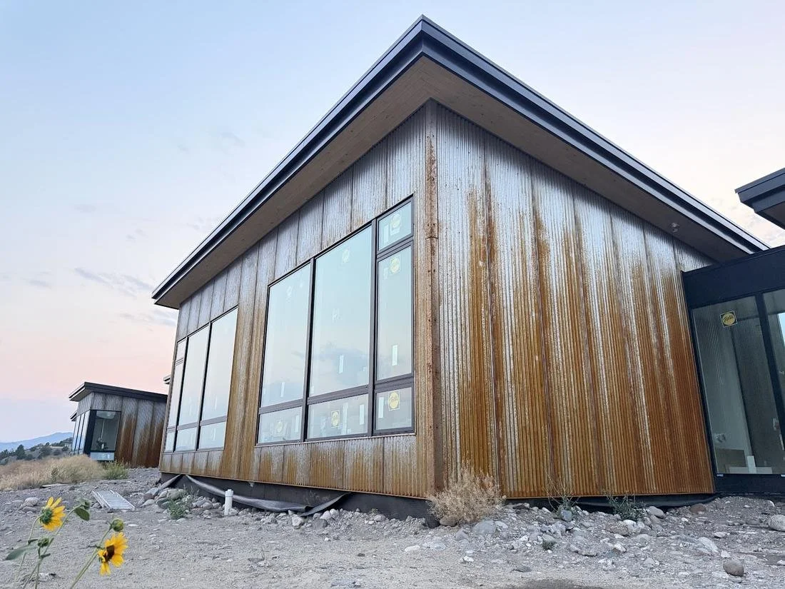 Cedar siding and large windows on the Paradise View home