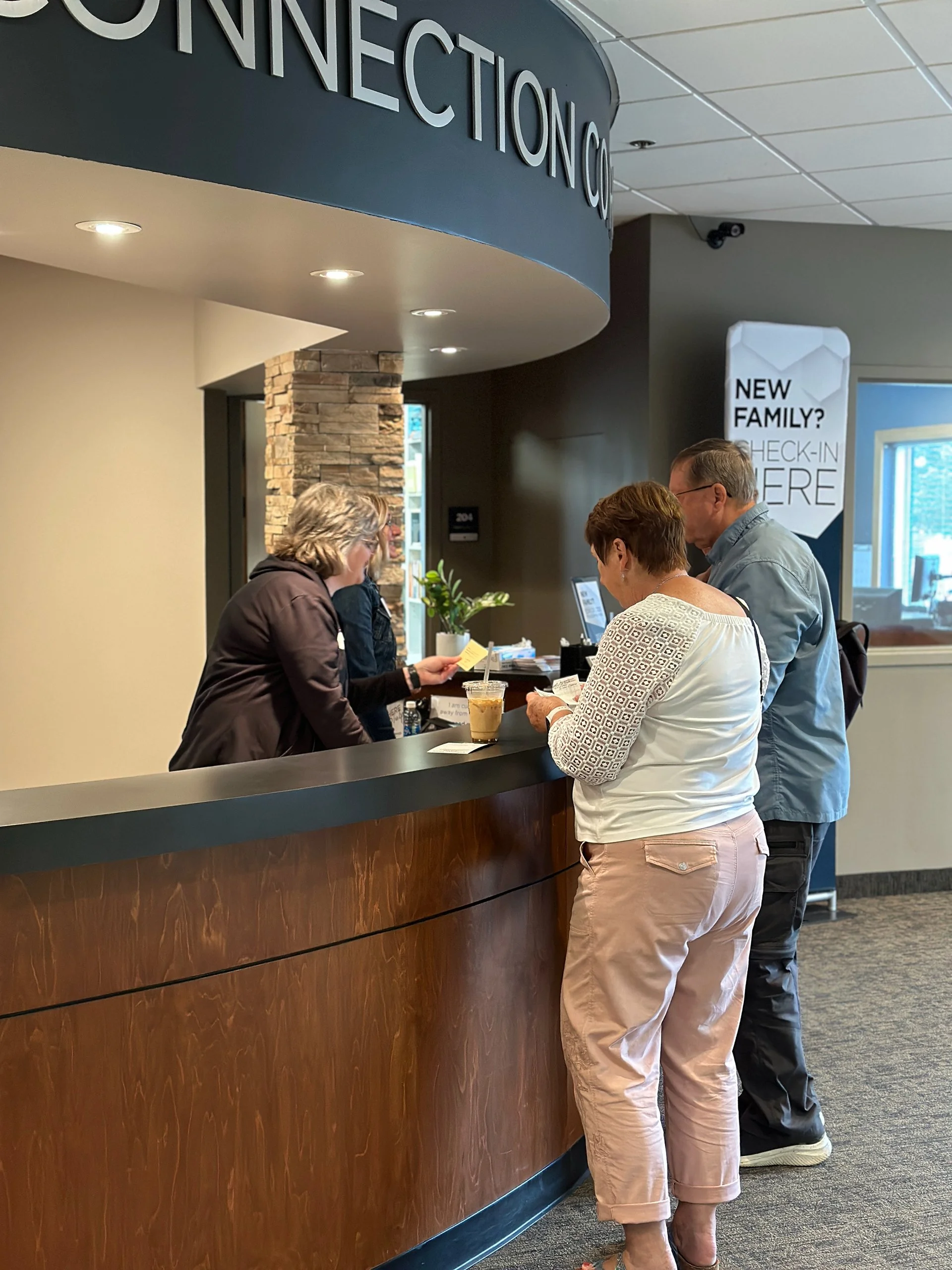 Volunteers helping guests at Connection Corner on Sunday