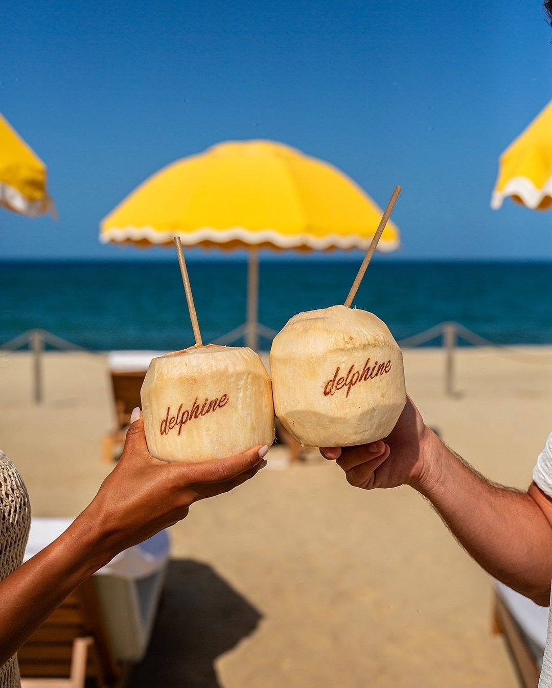 Coconut in one hand, cocktail in the other. The Delphine way.
