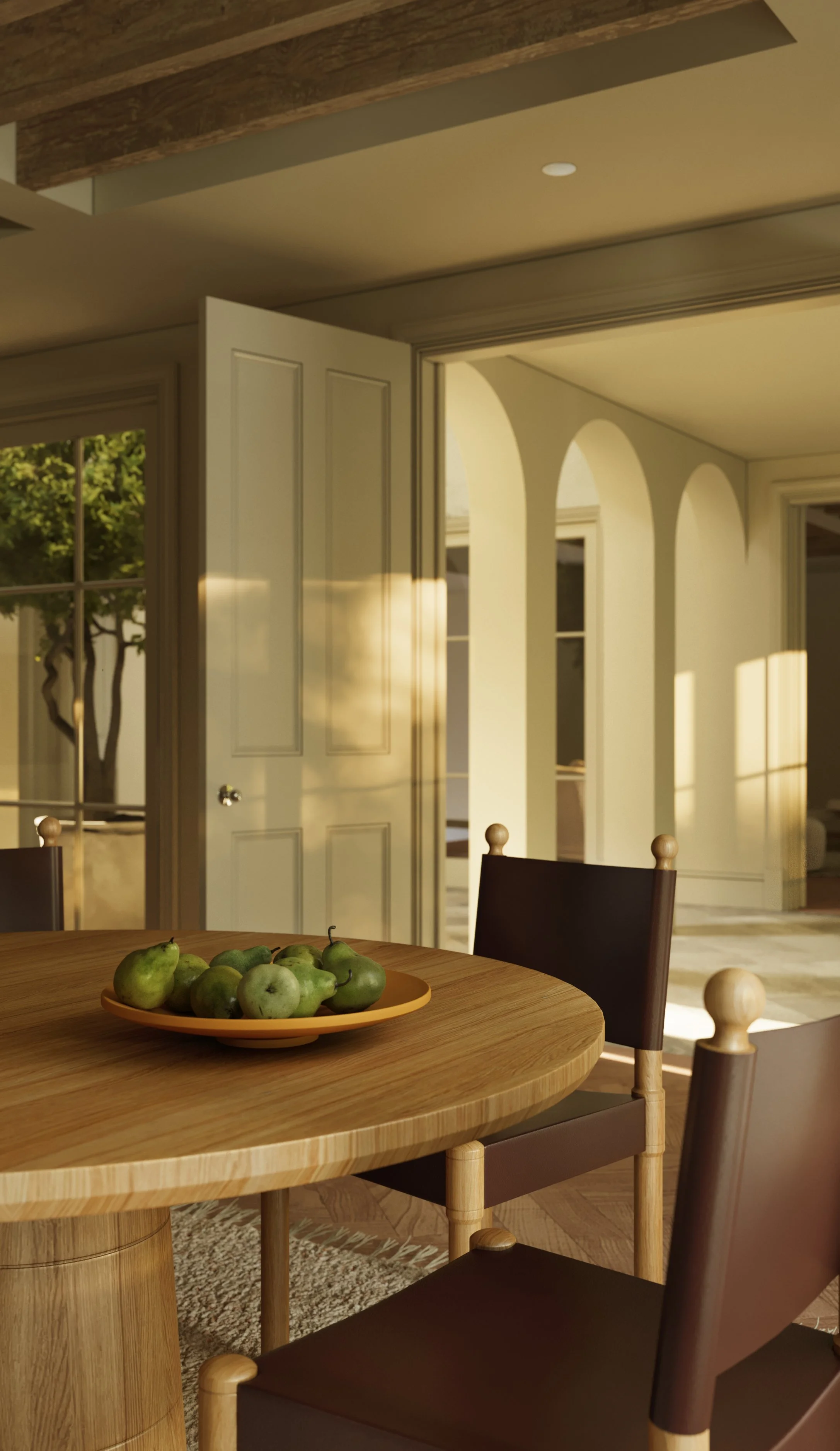 Interior rendering detail of a round oak dining table with a plate of pears and leather-backed chairs in warm sunlight.