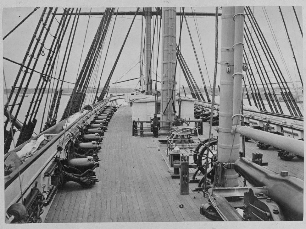 The spar deck of USS Santee.  Note the 32-Pounders of 4,500 Pounds and the 11-Inch Dahlgren mounted in the aft pivot position.