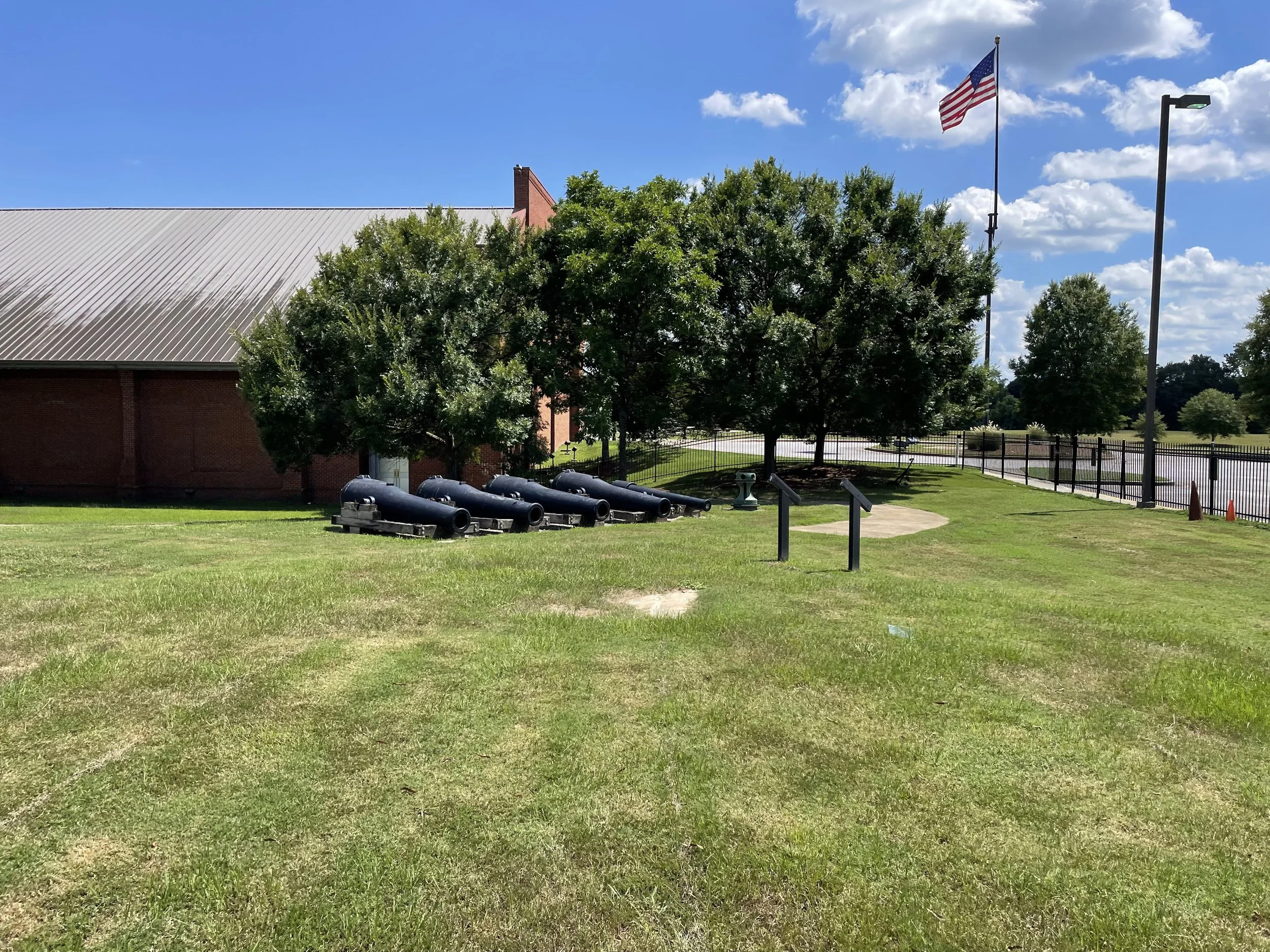 Four 9-Inch Dahlgrens and a US Navy 30-Pounder Parrott Rifle are displayed beside the National Civil War Naval Museum