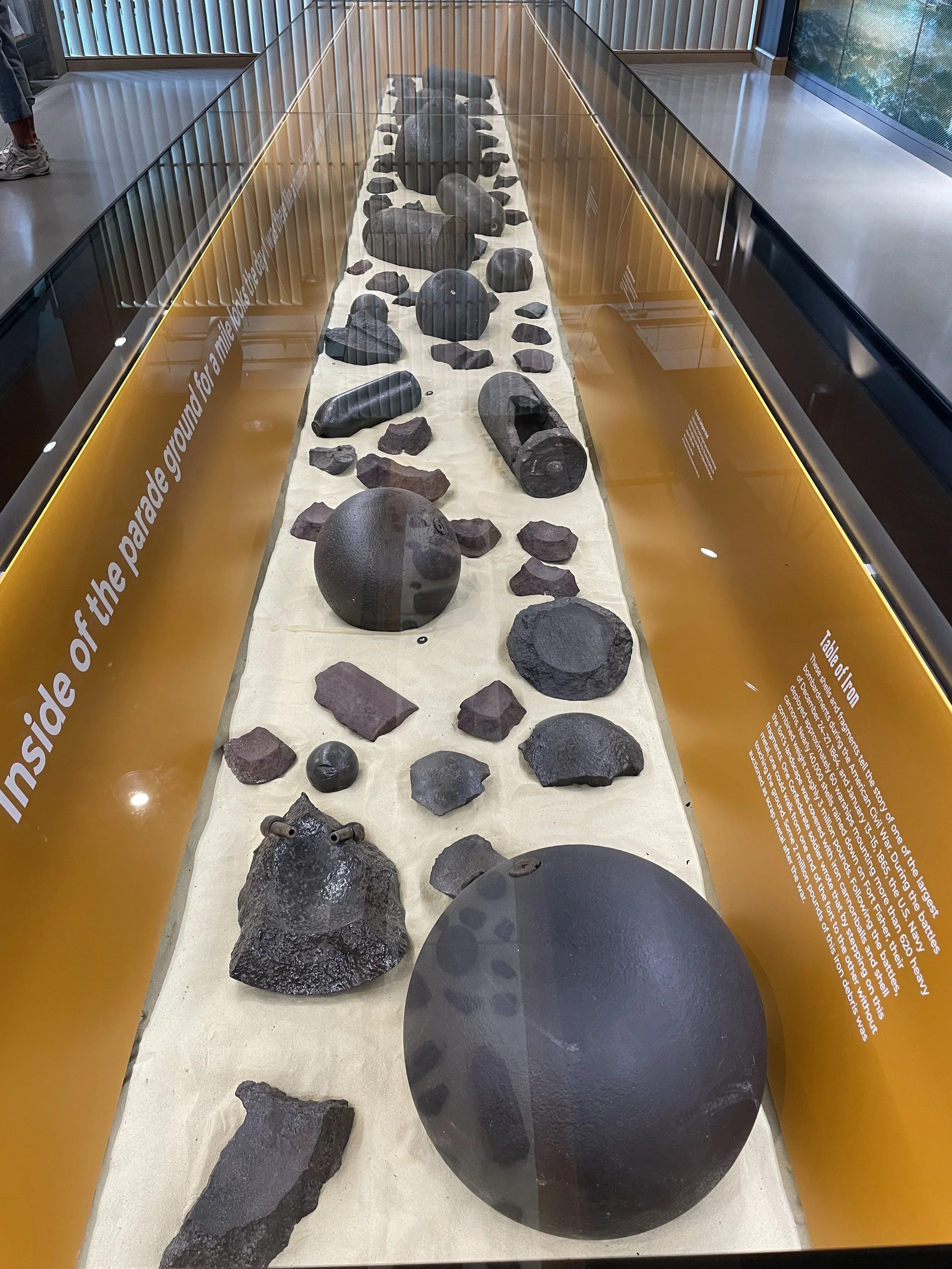 A giant 15-Inch Shell of the type fired by USS Canonicus is the largest projectile in the display of US Navy projectiles and fragments displayed at Fort Fisher State Historic Site (2025 photos).