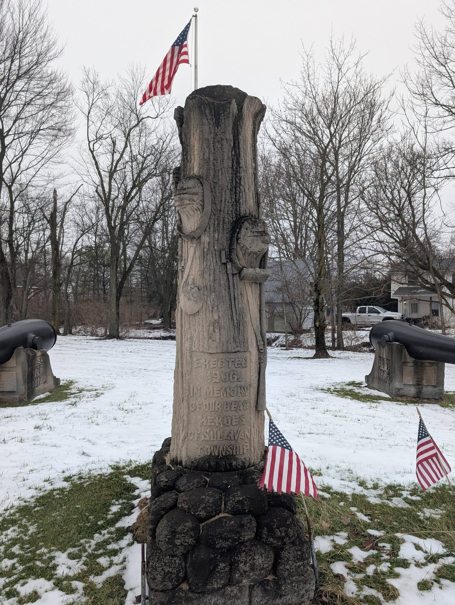 The monument between the two Rodmans states that they were placed in 1906 “In Memory of Our Dead Heroes of Sullivan Township.” Photo shows the tree shaped monument.