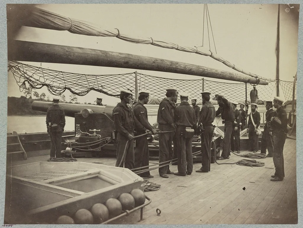 Crew drill at one of the 100-Pounder Parrott Rifles aboard USS Mendota
