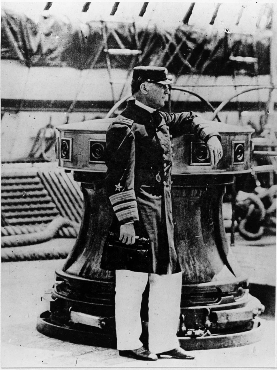 Admiral David Farragut standing next to a capstan aboard USS Franklin circa 1867