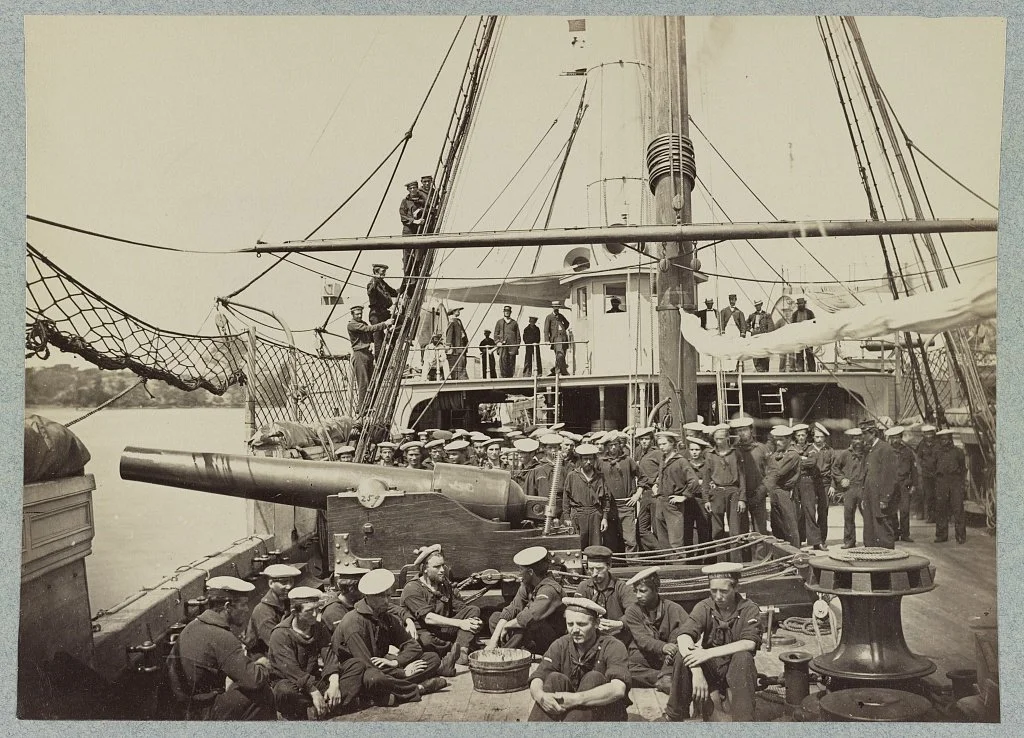 Crewmembers of Mendota pose around one of her 100-Pounder Parrott Rifles.