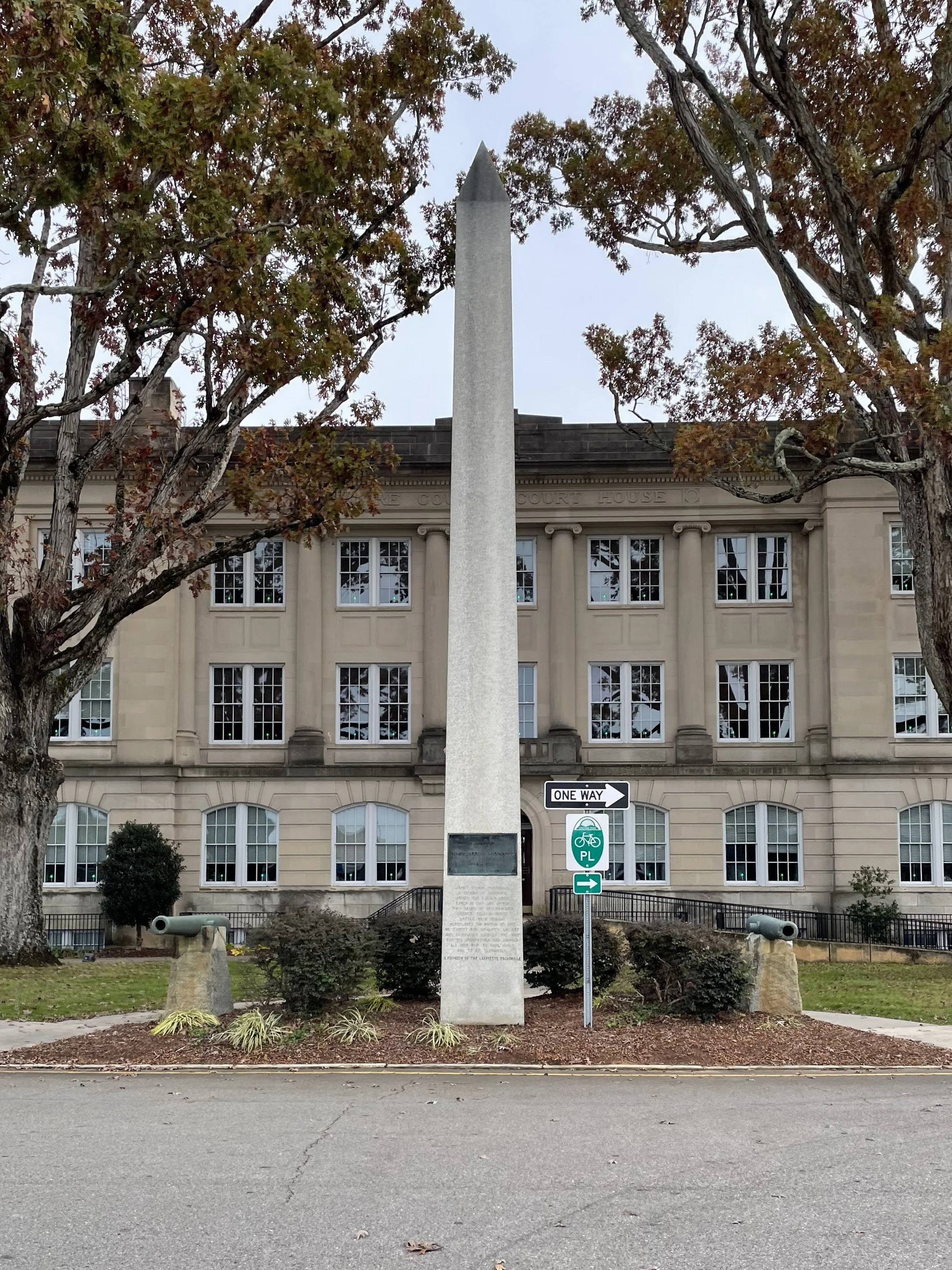 Two Napoleons (12-Pounder Field Gun-Howitzers of the American Civil War) flank a monument to James Roger McConnell in Carthage, North Carolina outside of the historic former Moore County Courthouse.