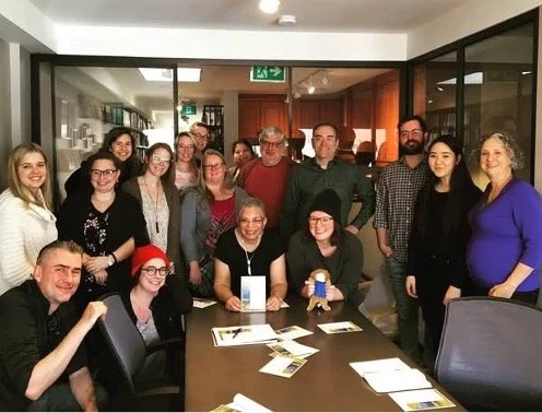 Bernice presents a Future Aces poster to the Toronto Prep School that hosted an educational and public event sharing the Herb Carnegie story.