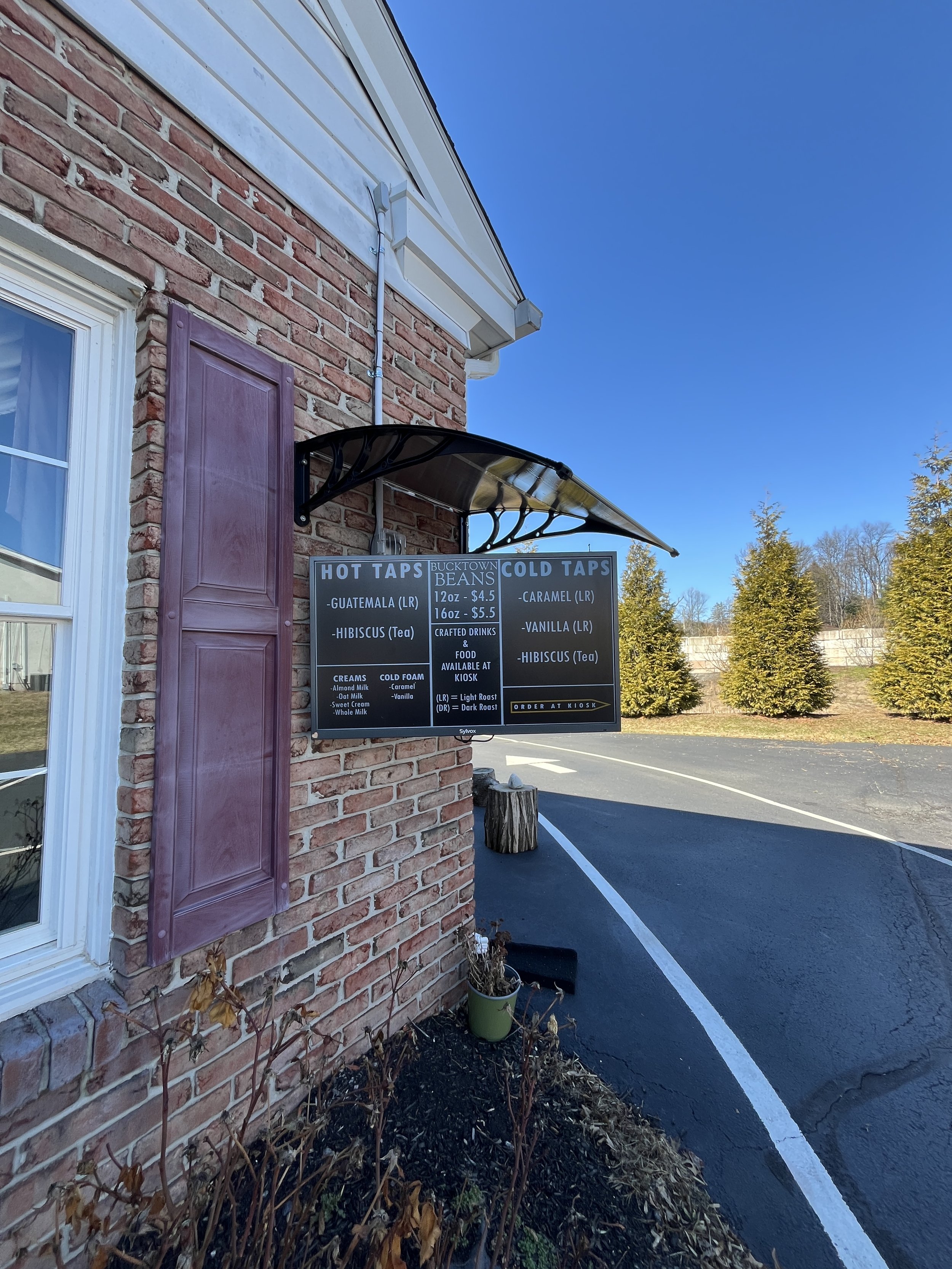 Brief menu on an outside monitor showing what is on hot and cold taps today.