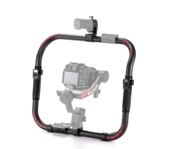 Square camera stabilizer rig with camera mounted inside, featuring black and red accents