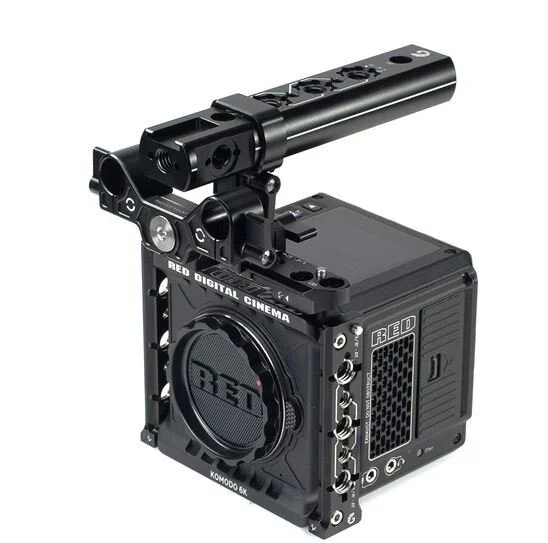 Camera rig with a RED digital cinema camera, mounted on a cage with a top handle, designed for professional filmmaking.