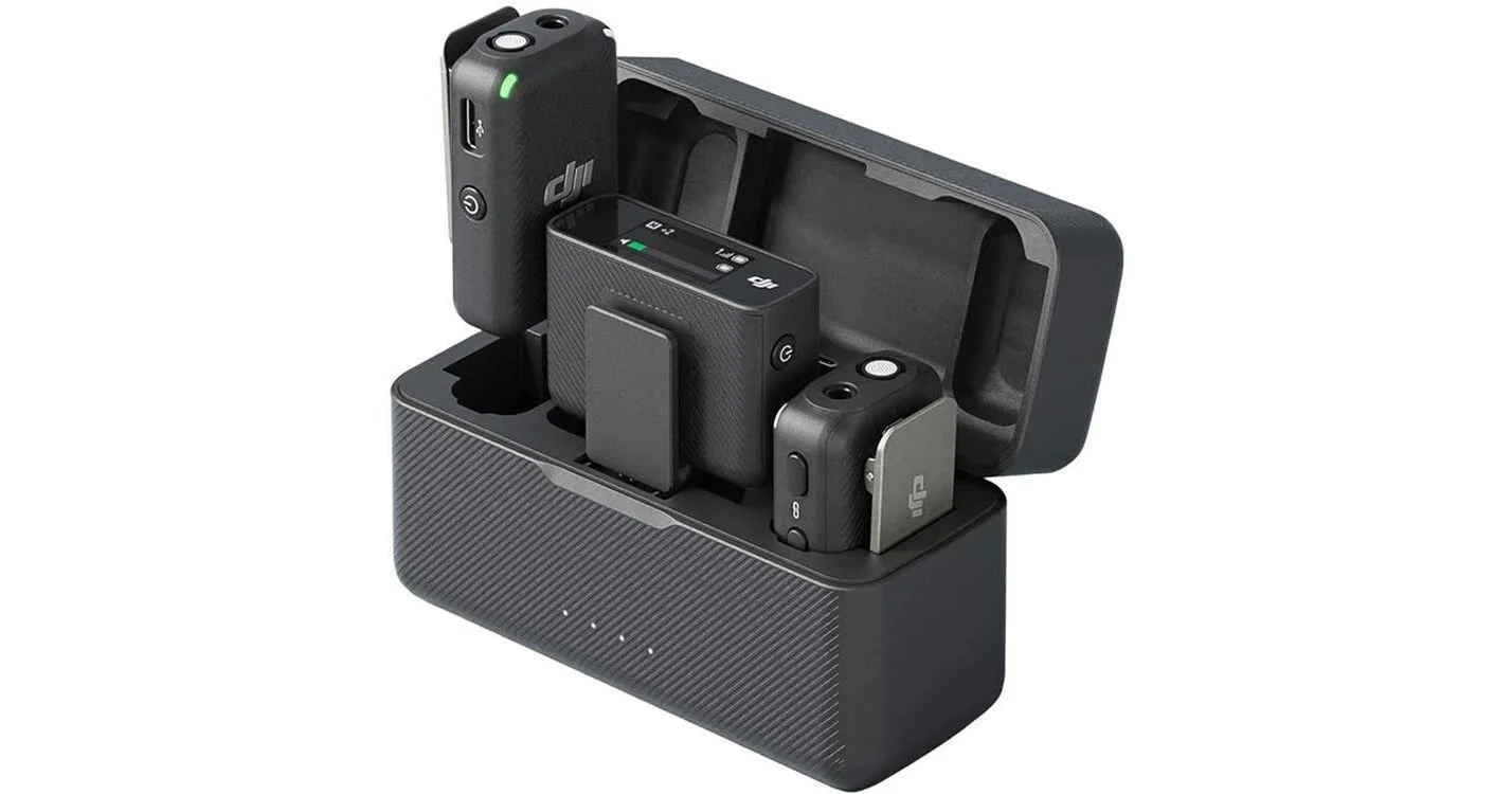 Charging dock with multiple DJI drone batteries and remote controllers.