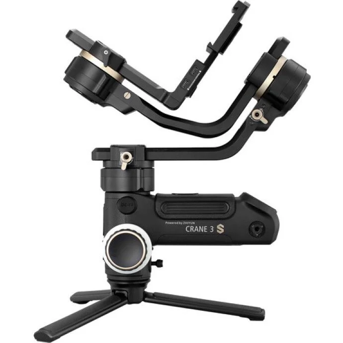 A handheld camera stabilizer with adjustable arms and tripod legs, labeled 'Crane 3S'.