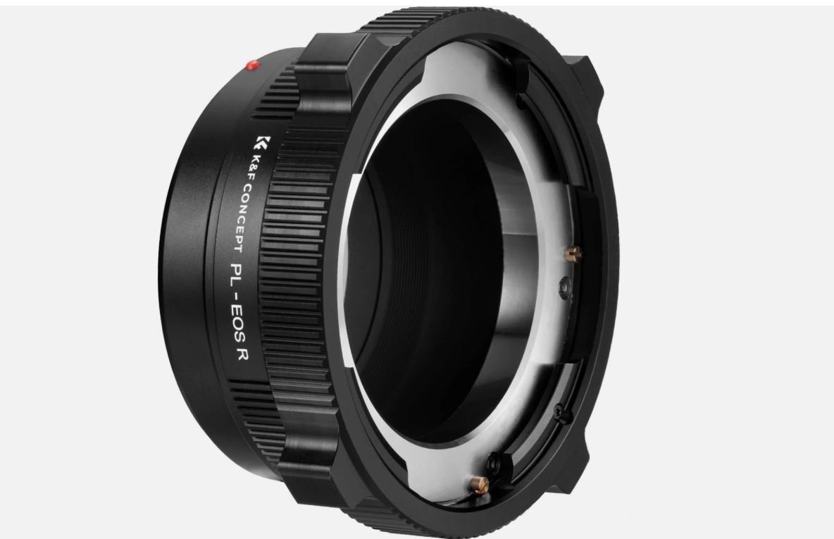 Close-up of a camera lens mount adapter with black exterior and metallic interior, marked with brand and model information.