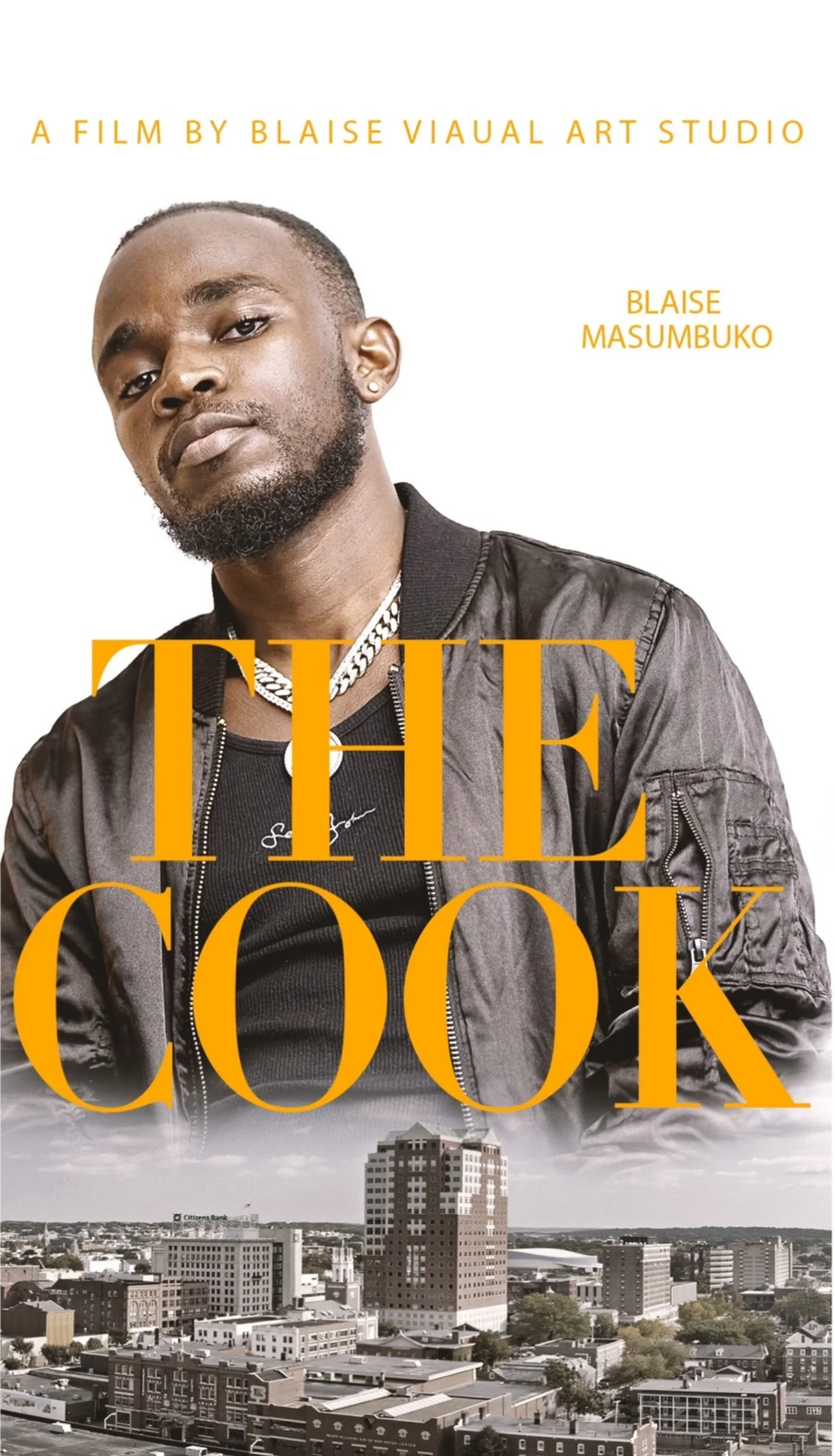 Book cover featuring a young man with a beard and earring, wearing a black jacket and chain, with cityscape at the bottom, large orange text saying "THE COOK", and smaller yellow text indicating it is a film by Blaise Viau Art Studio and author Blais