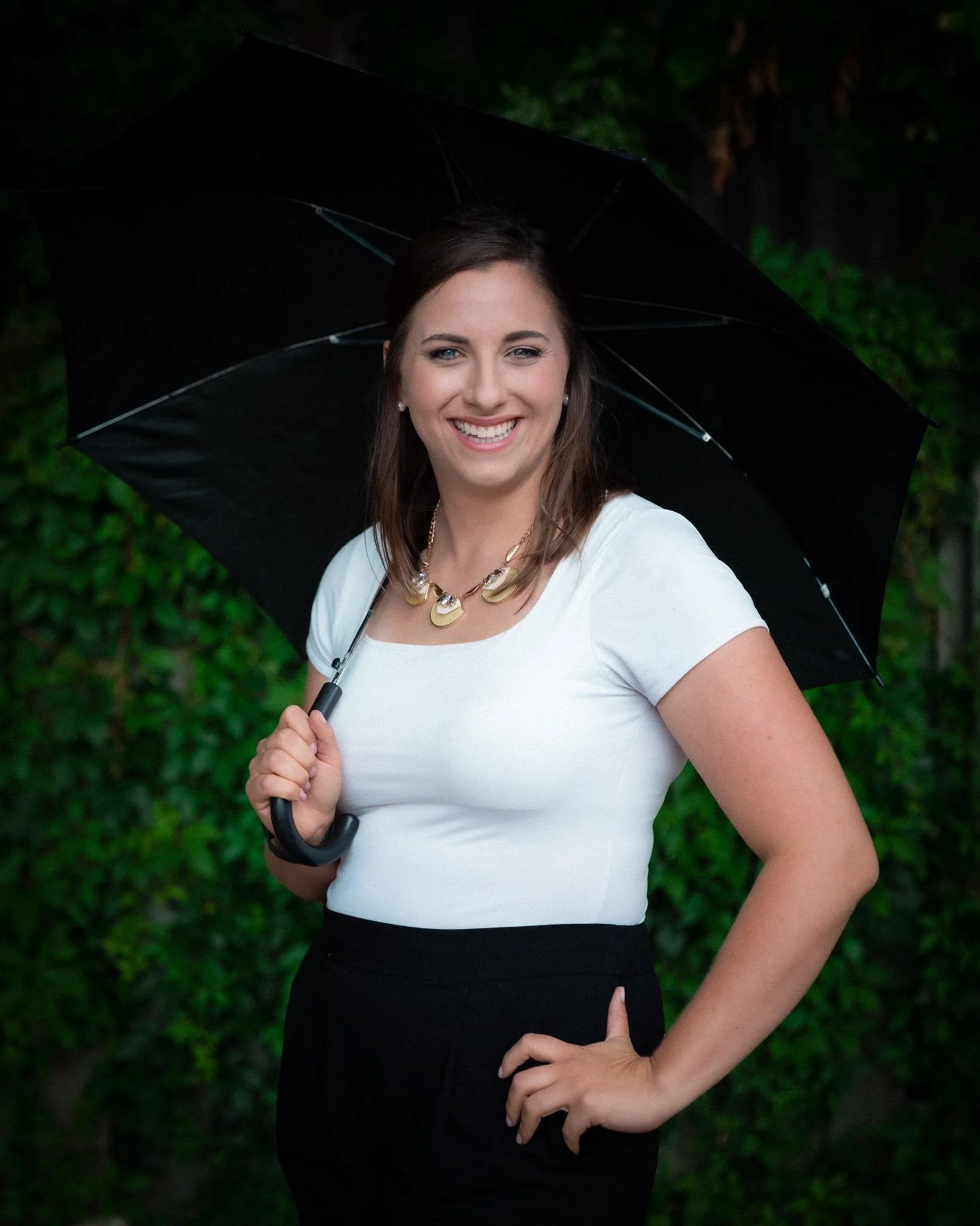 Smiling woman holding an umbrella