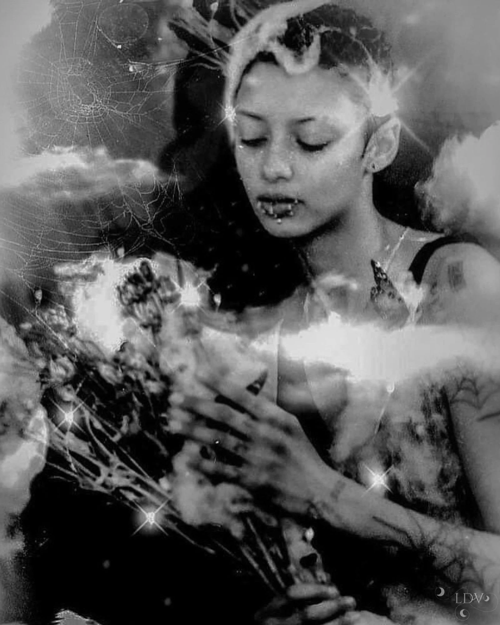 A woman wearing a patterned kimono-style top and olive green harem pants walking barefoot through a sunlit forest path, with autumn leaves scattered on the ground.