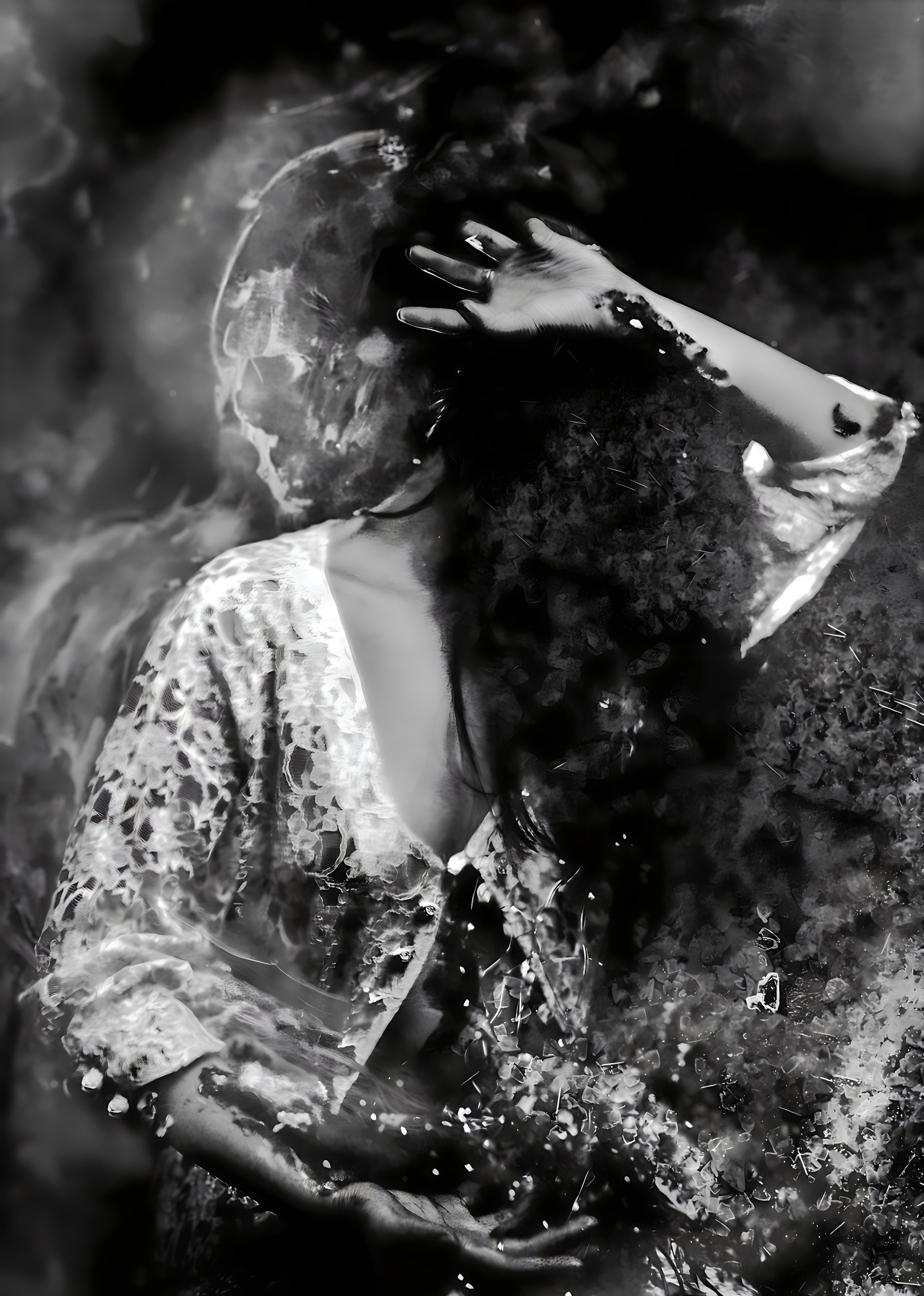 Surreal black and white image of a woman partially obscured by abstract patterns and smoke, wearing a lace garment, with her hand raised near her face.