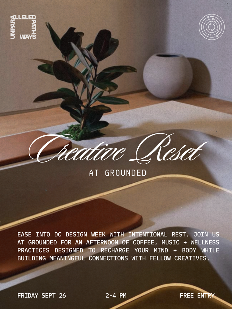 A promotional poster for 'Creative Reset at Grounded,' an event during DC Design Week featuring coffee, music, and wellness practices. The background shows a plant, a white vase, a ceramics tabletop, and a paper or fabric surface.