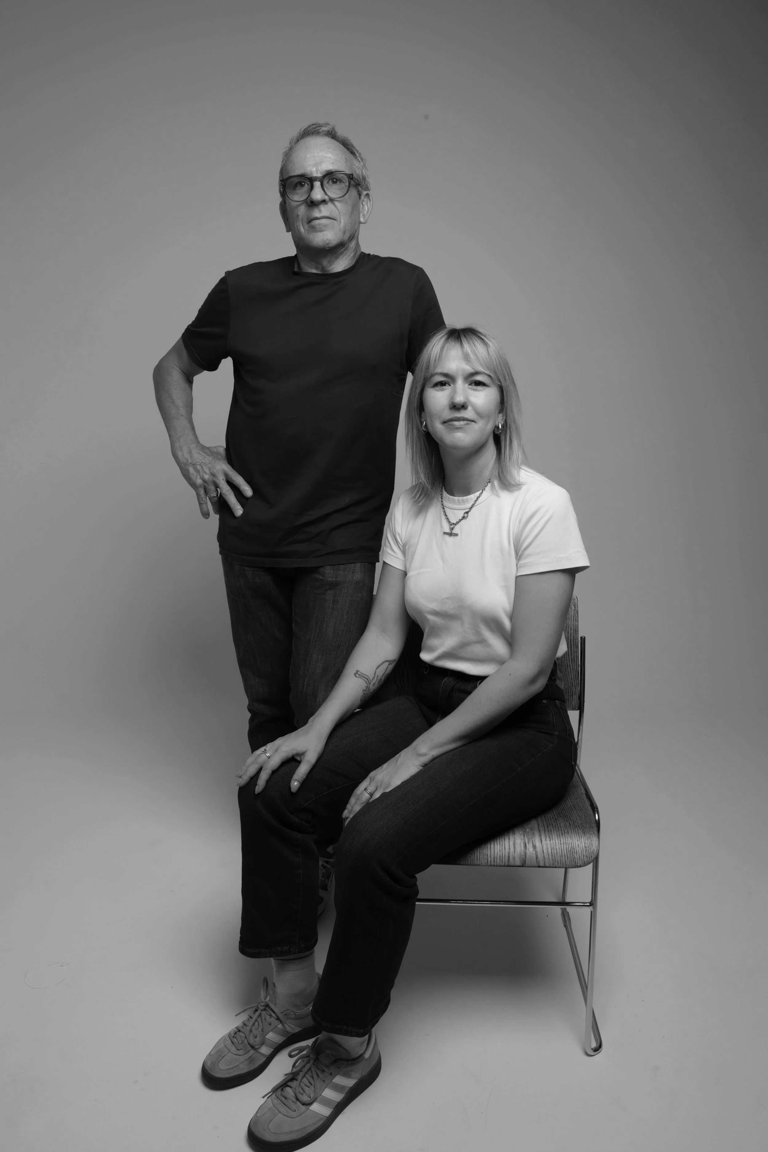 Black and white photo of Studio Duos team against a plain background.
