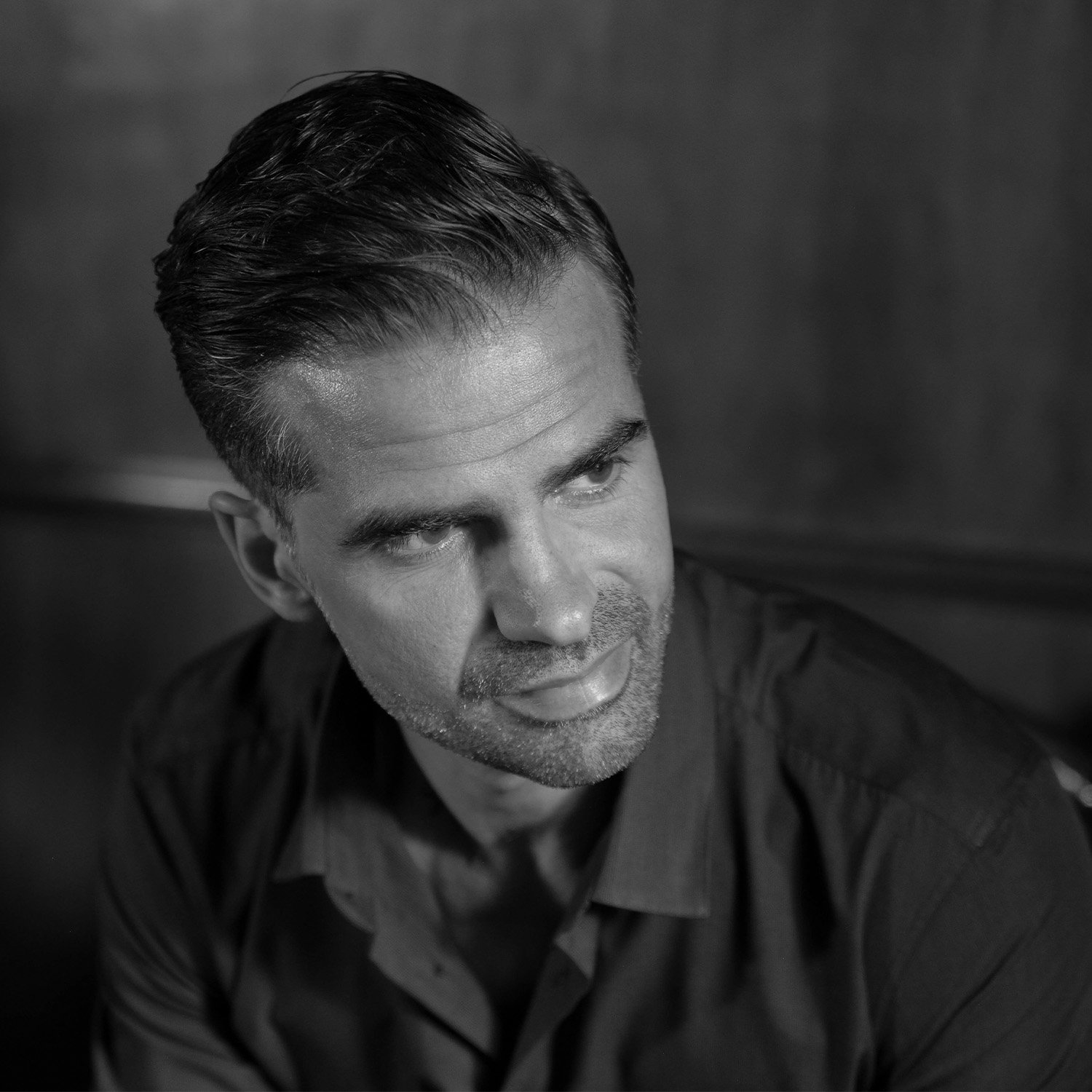 Black and white portrait of Julien Roussel, founder of Story Nexus Media.