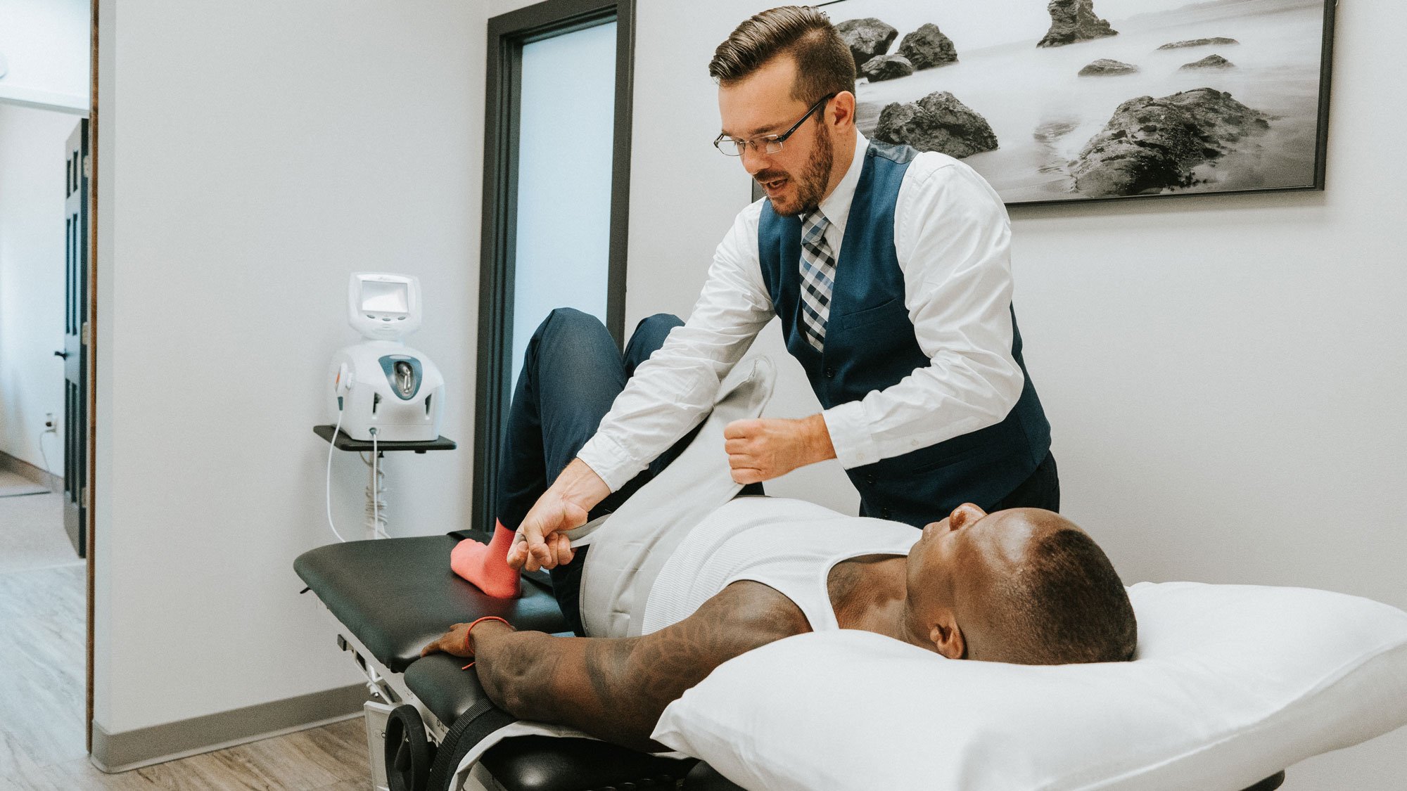 Dr. Swinton adjusting a patient