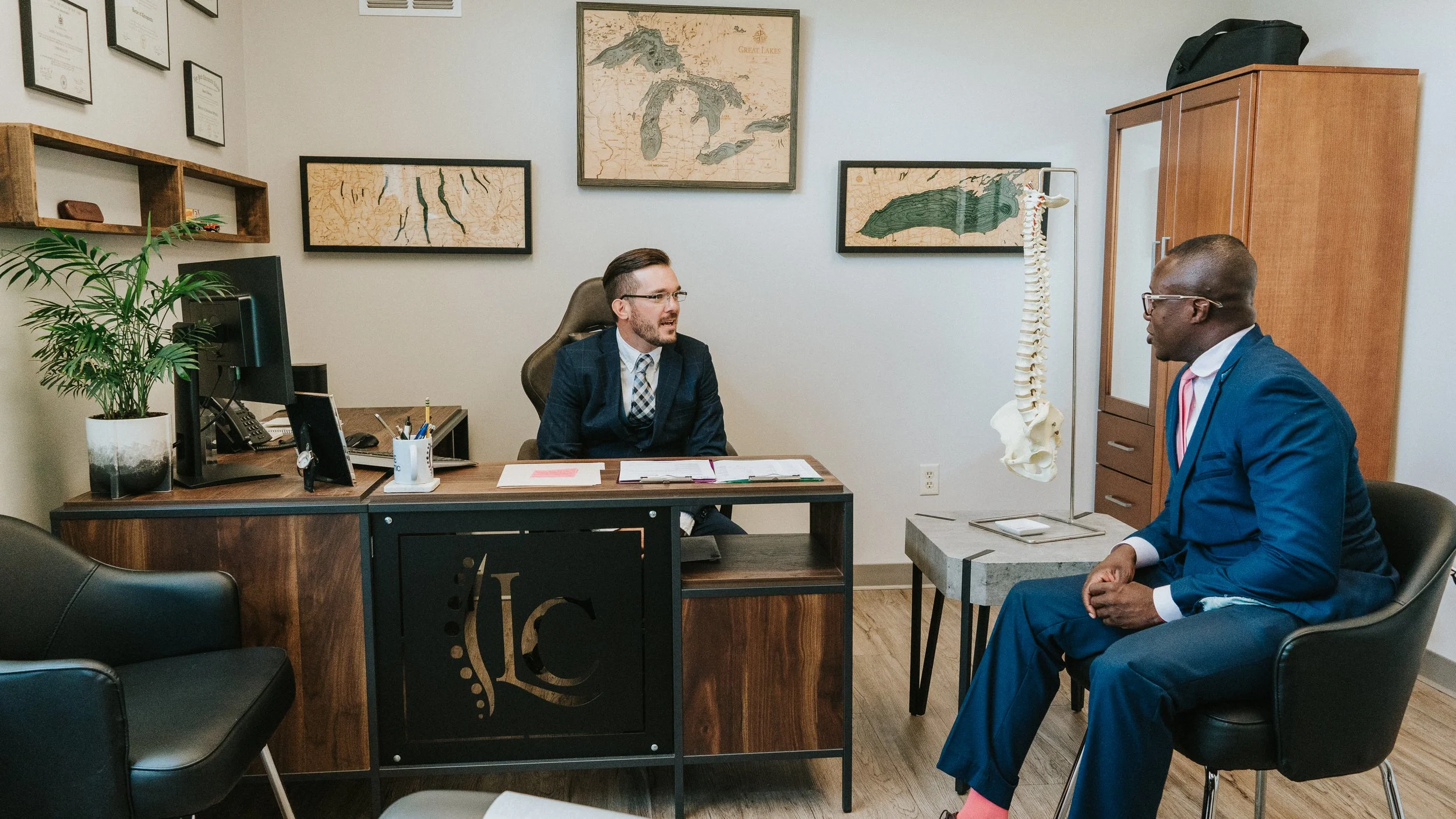 Dr. Swinton talking with a patient in his office