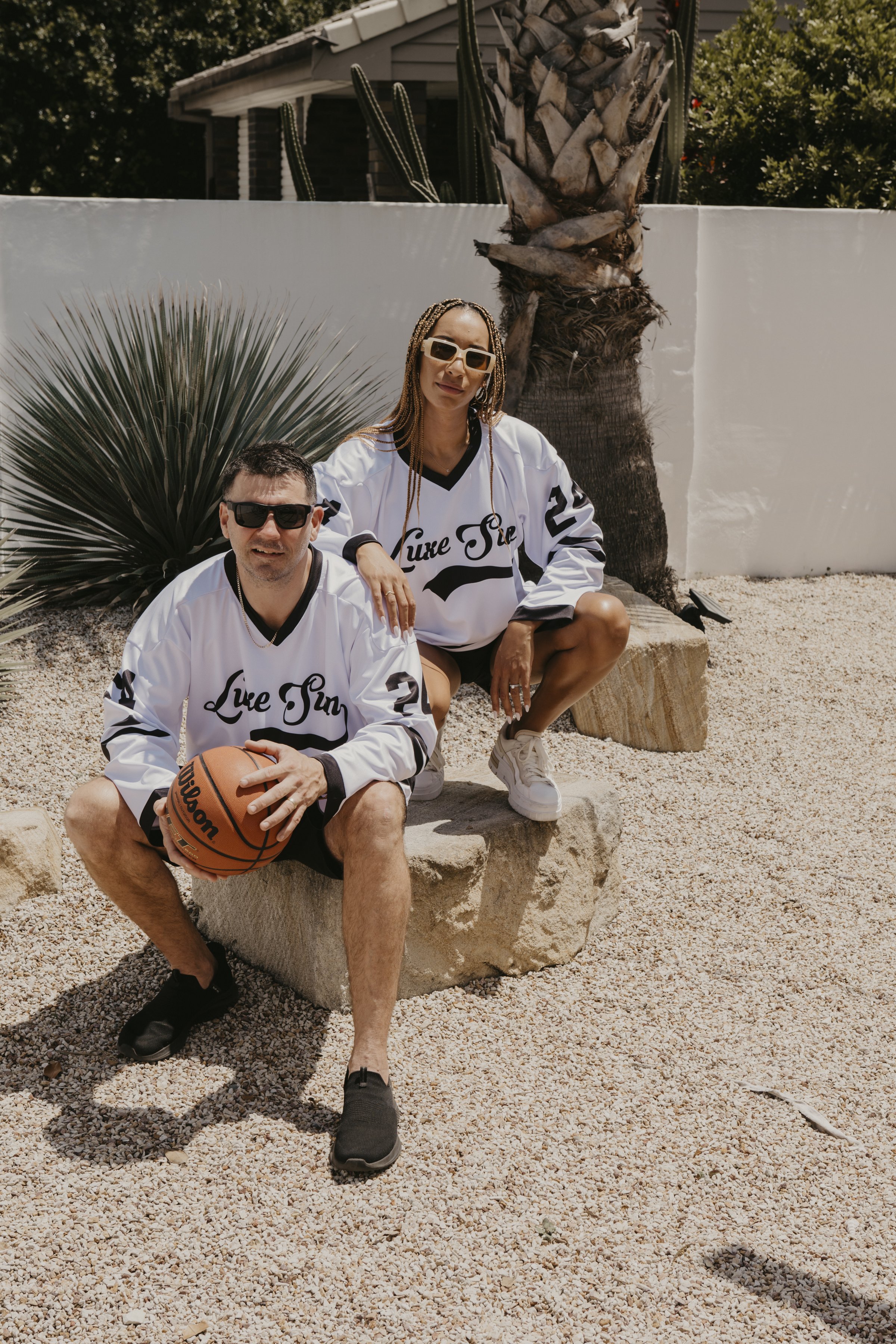 Woman and man with basket ball in white Luxe Sun Jersey